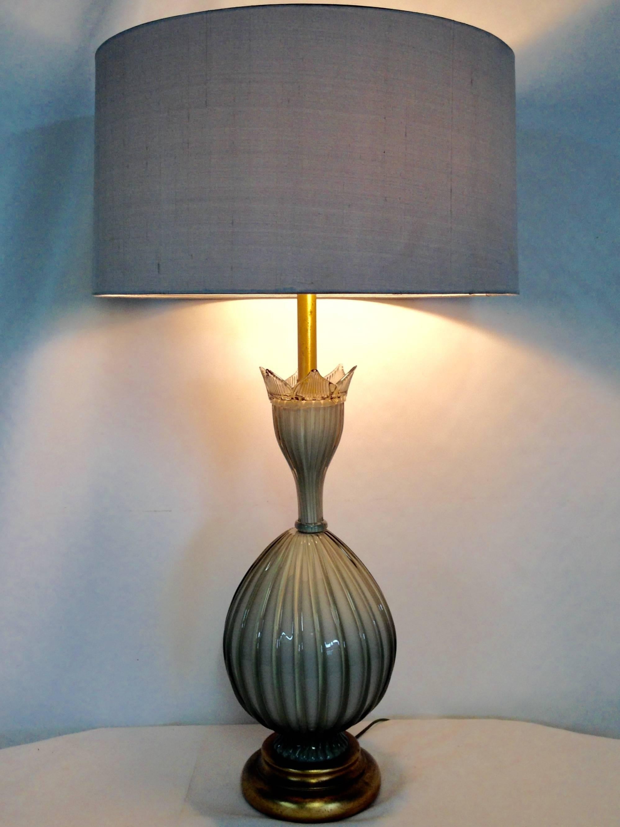 Vintage Italian Murano Glass Lamp By,  Marbro Lamp Company Features a sculptural rare ribbed sage gray Murano glass lamp on gilt wood base. Brass fittings and original Marbro manufacture's sticker in place. Wired for the US and in working order;