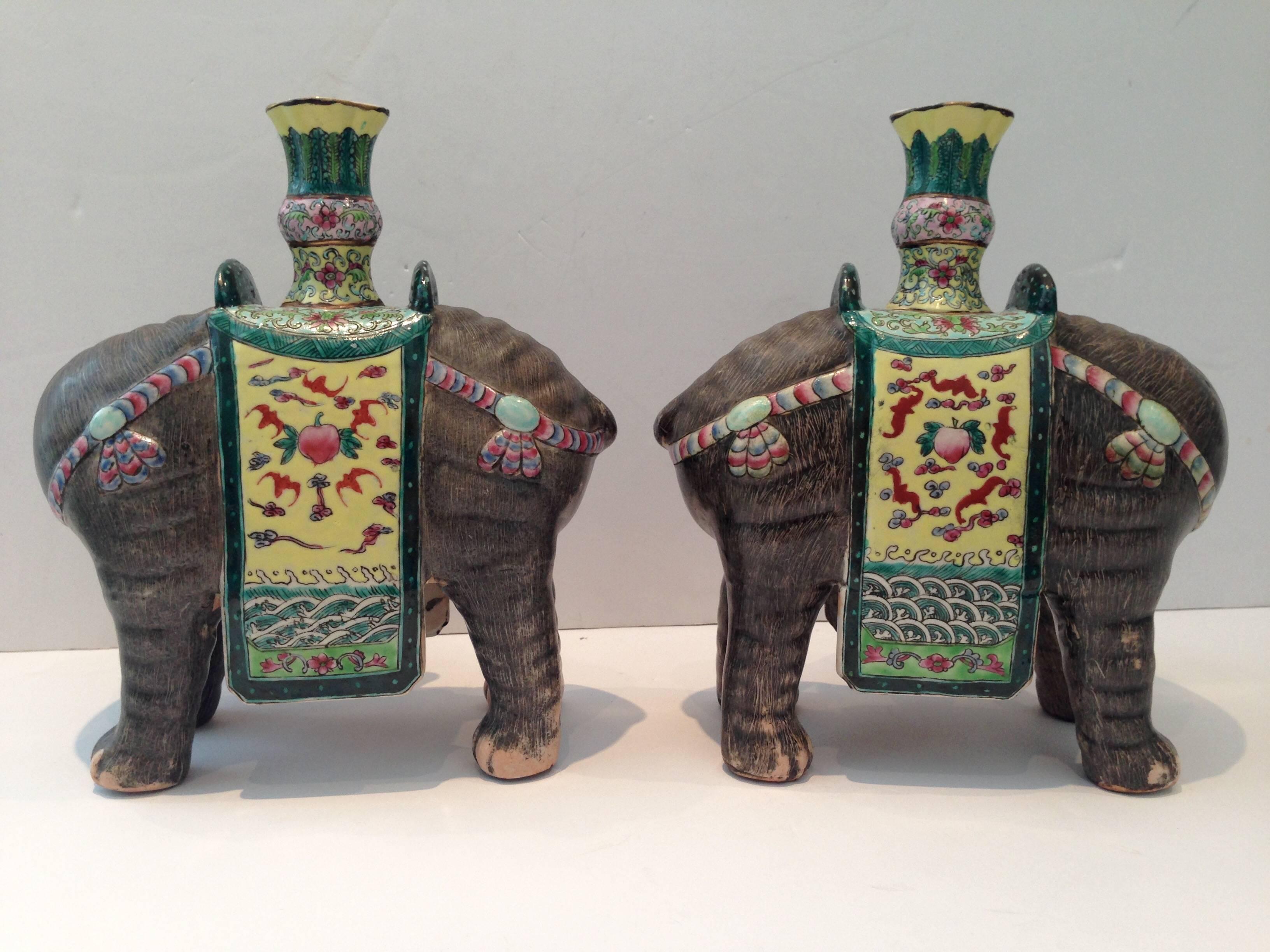 Exceptional pair of Chinese export hand-painted, highly detailed famille elephant candlestick holders.