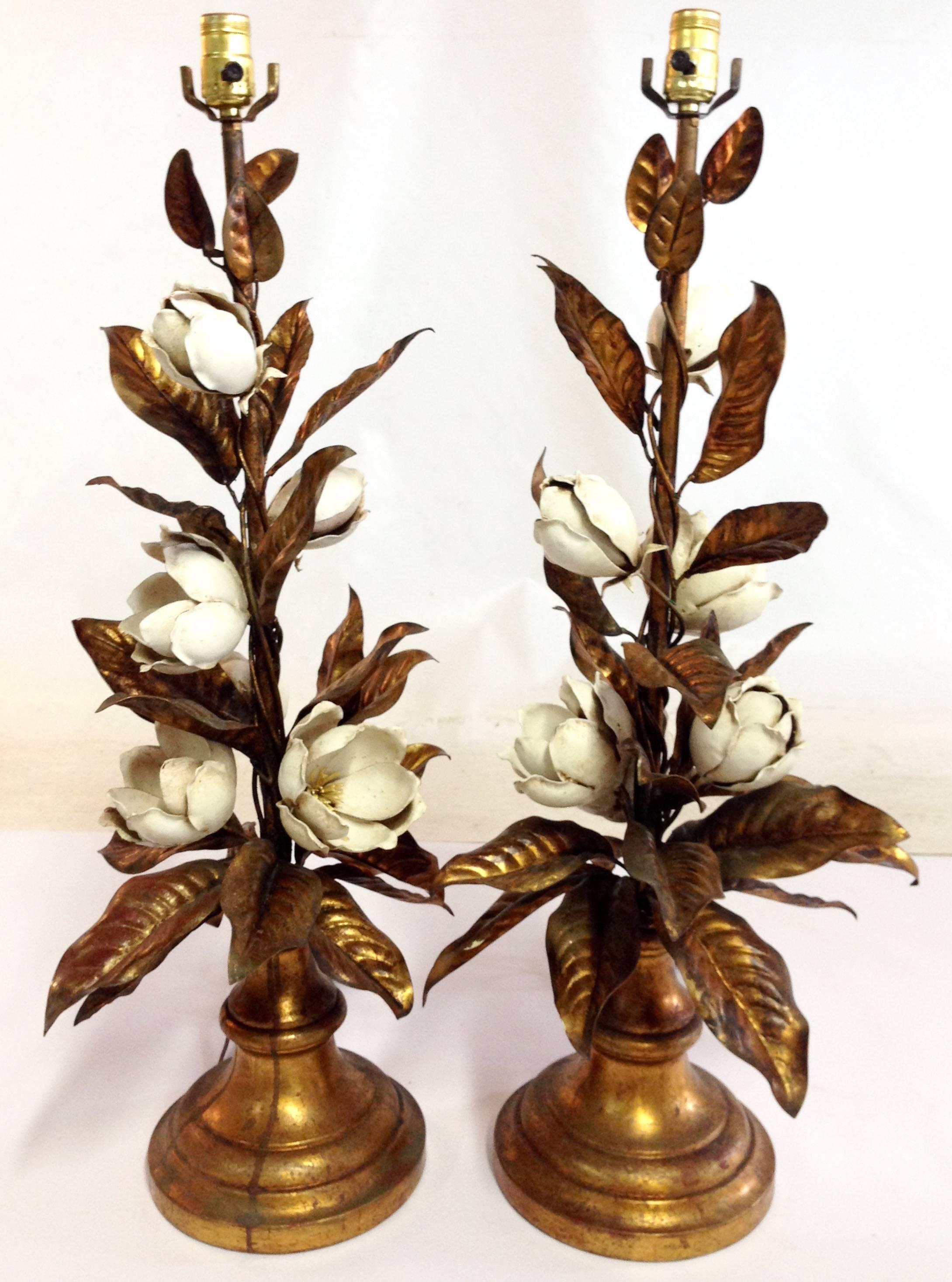 Pair of Italian gilt tole leaf and rose lamps on giltwood bases with off-white silk shades. Each shade has gold gilt rose and vine motif appliqués made of resin. Leaves are adjustable. Each lamp signed with metal hang tag: 