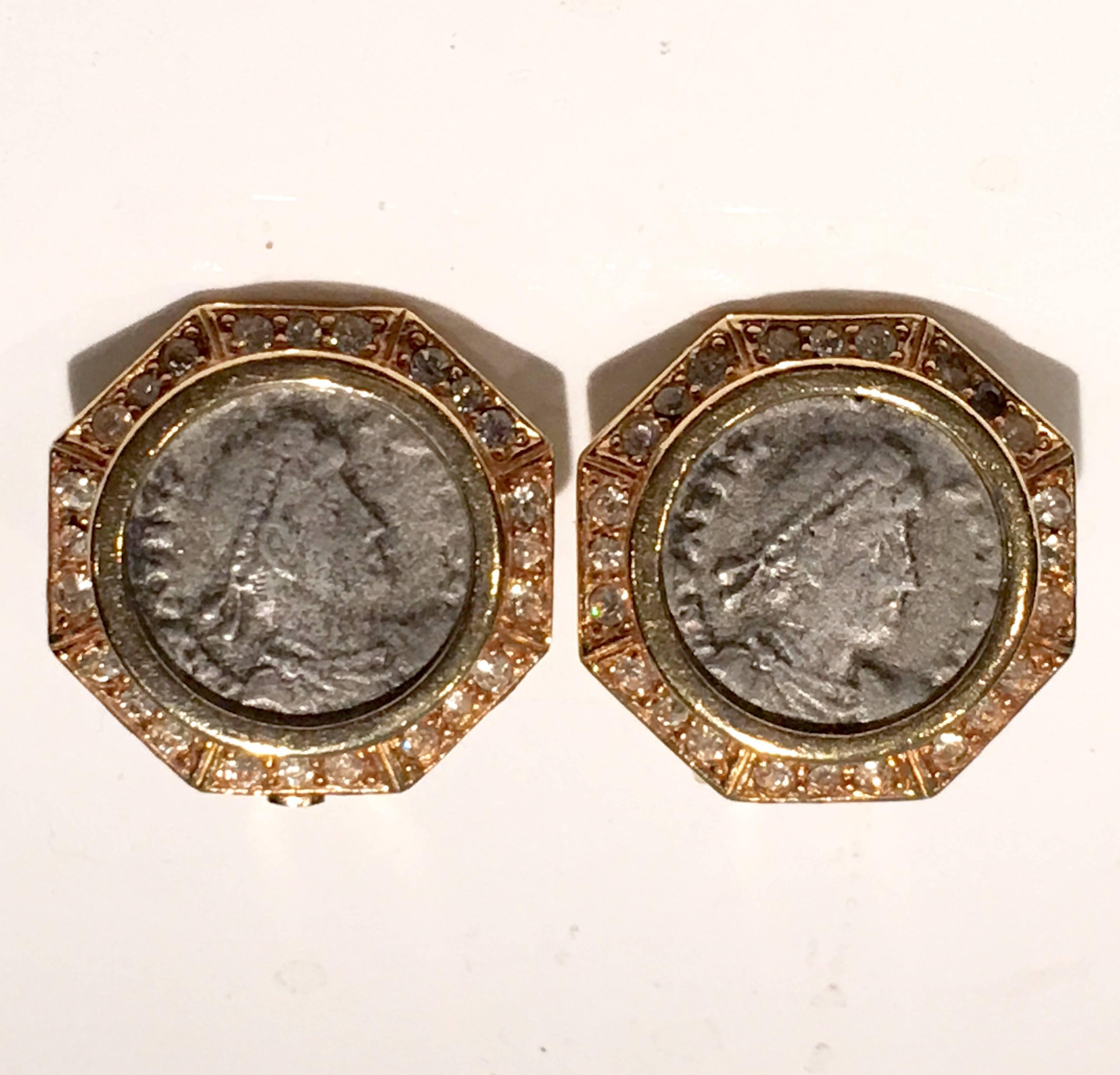 Vintage 18-karat yellow gold-plated Roman coin earnings with crystal rhinestone surround and pewter colored faux roman coin center. Engraved signed in two places, back of earring and on clip.
     