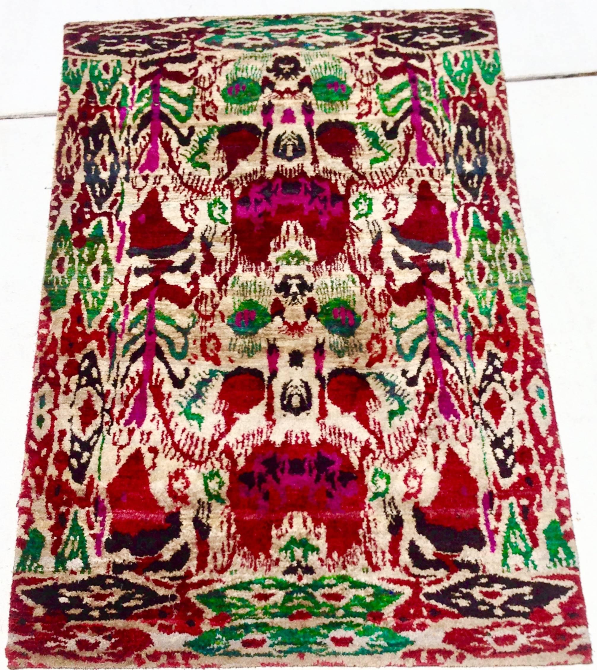 Vintage, One Of A Kind Custom Vibrant Jewel Tone Silk Ikat Hand Knotted Rug Made From Vintage Silk Sari's. This One-of-a-kind piece reinvents traditional patterns and ancient motifs through a contemporary chromatic spectrum. Handmade by master