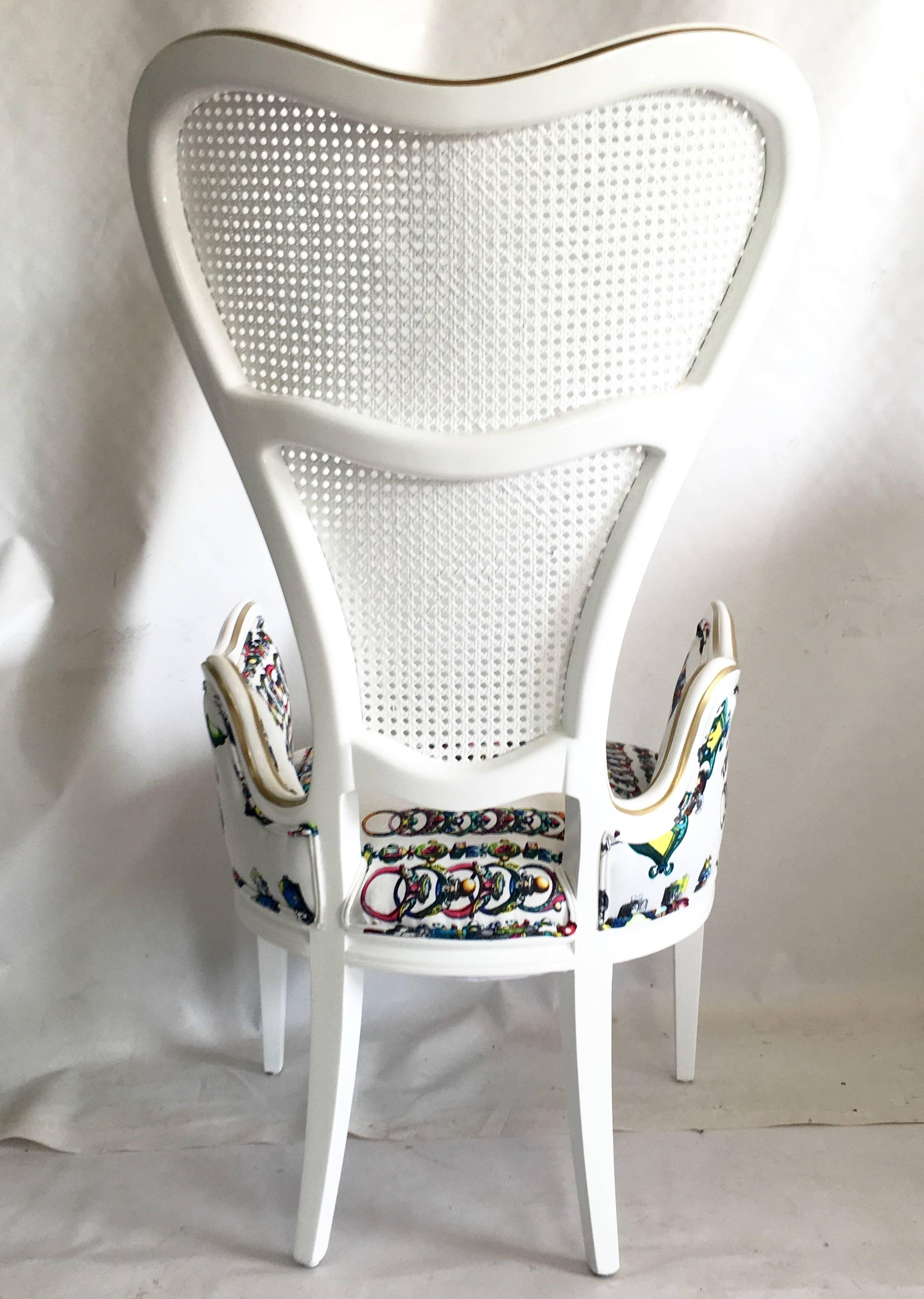 Mid-Century Hollywood Regency, whimsical wood and double cane high back heart chair. Newly lacquered in bright semi gloss white with gold metallic matte detail throughout. New Christian Lacroix 100% cotton sateen La main Au Collet, Bougainvillier