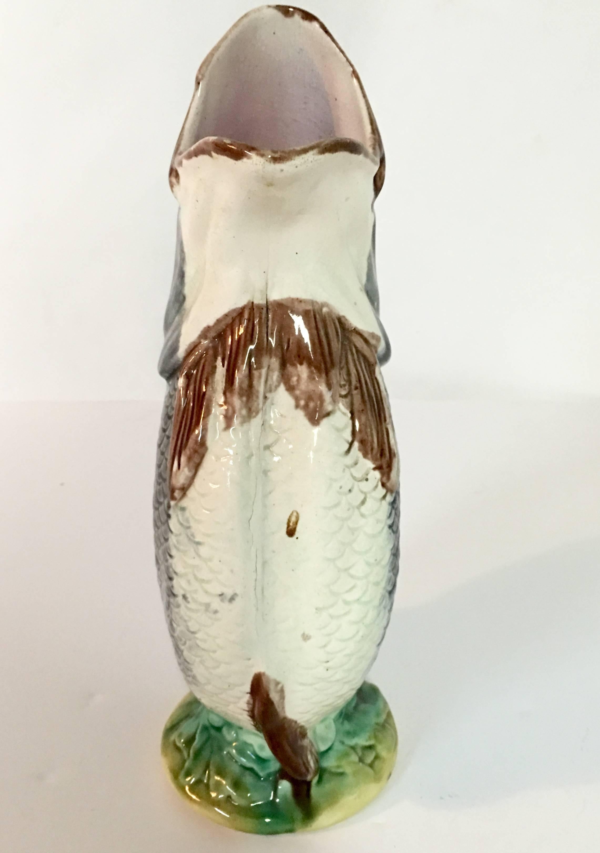 antique gurgling fish pitcher