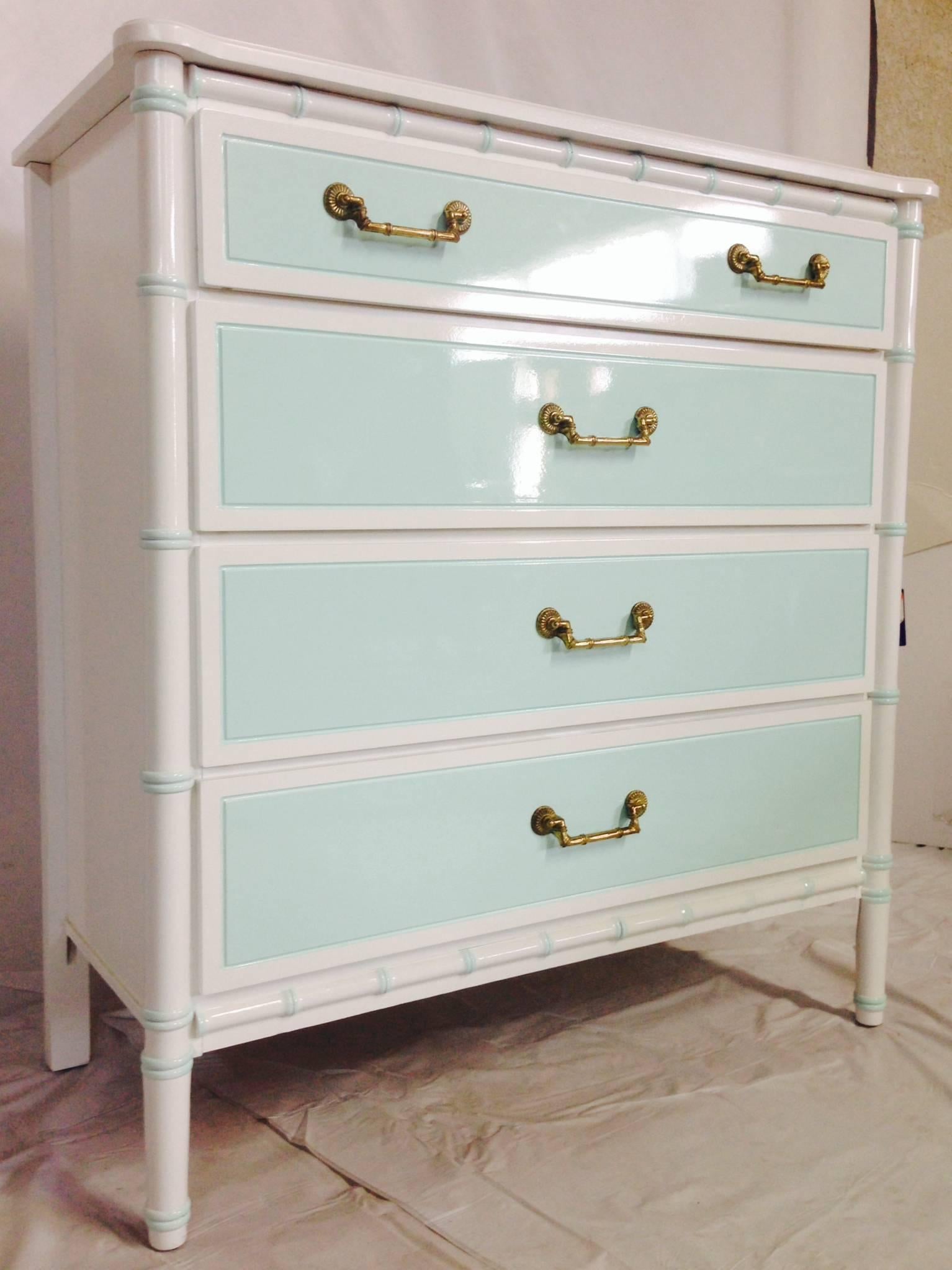 Newly refurbished, faux-bamboo four-drawer tall dresser. Finished in two-tone mint and white high-gloss lacquer paint. Original gold faux-bamboo solid brass hardware restored. Finished on all four sides including, interior of drawers. Light Mint is