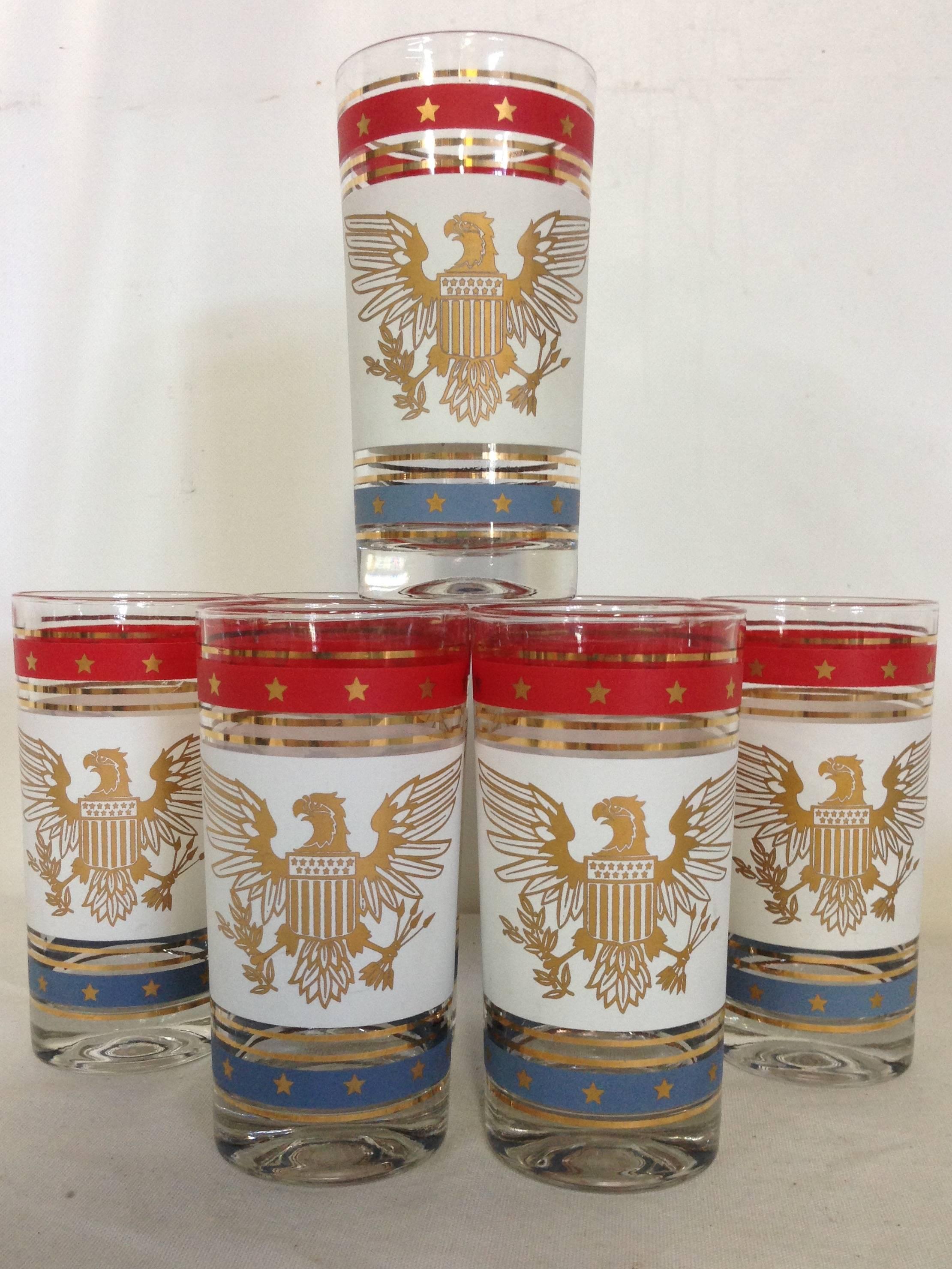 Set of seven vintage red, white, blue and 22-karat gold hand-painted American bald eagle high ball glasses. No makers mark.