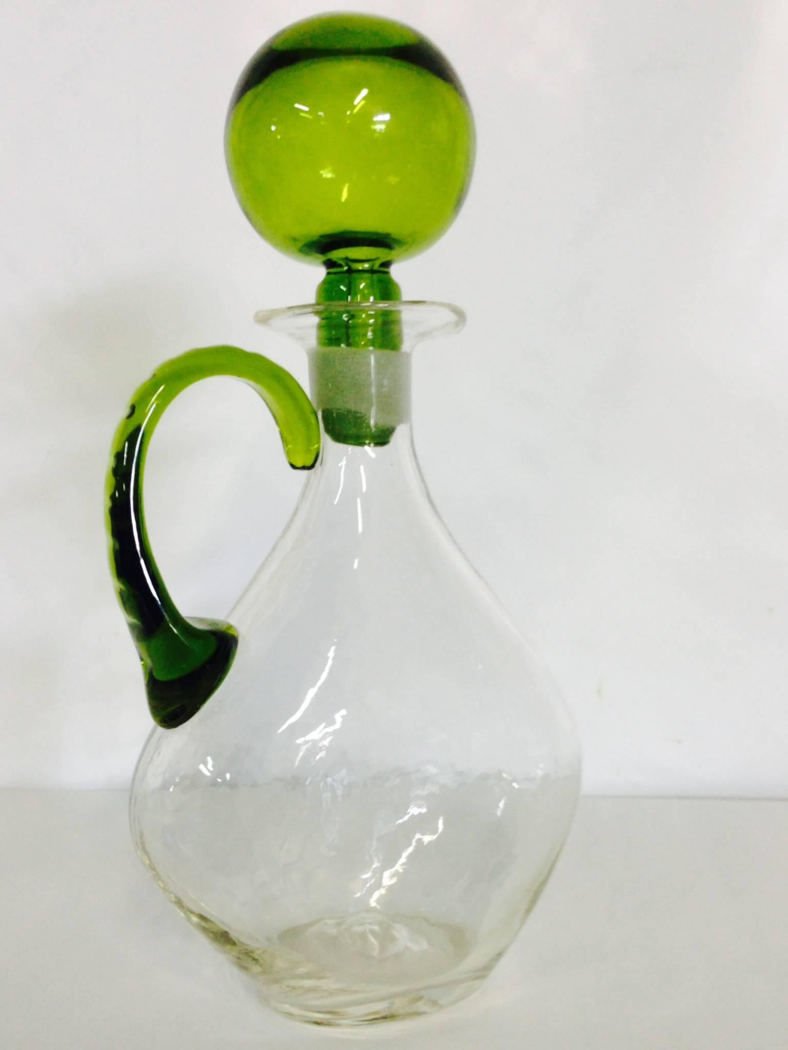 Rare Mid-Century Blenko glass clear crackle blown glass decanter. Applied green handle and large round green dimpled stopper. Blenko pontil mark at bottom base.