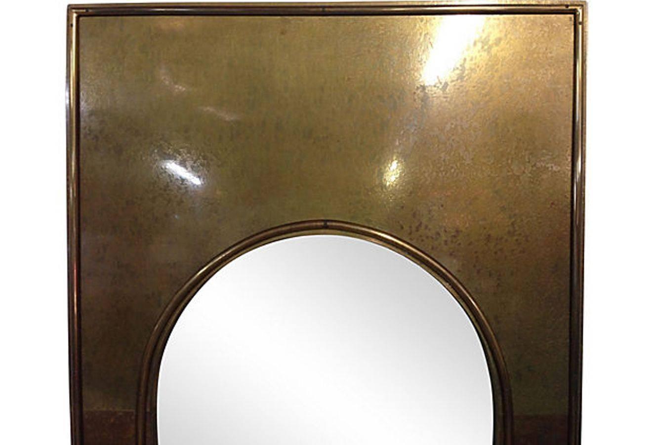 Solid brass full length mirror with Moorish style arch by Mastercraft. This framed brass clad mirror is heavy and substantial with an intentional patina.