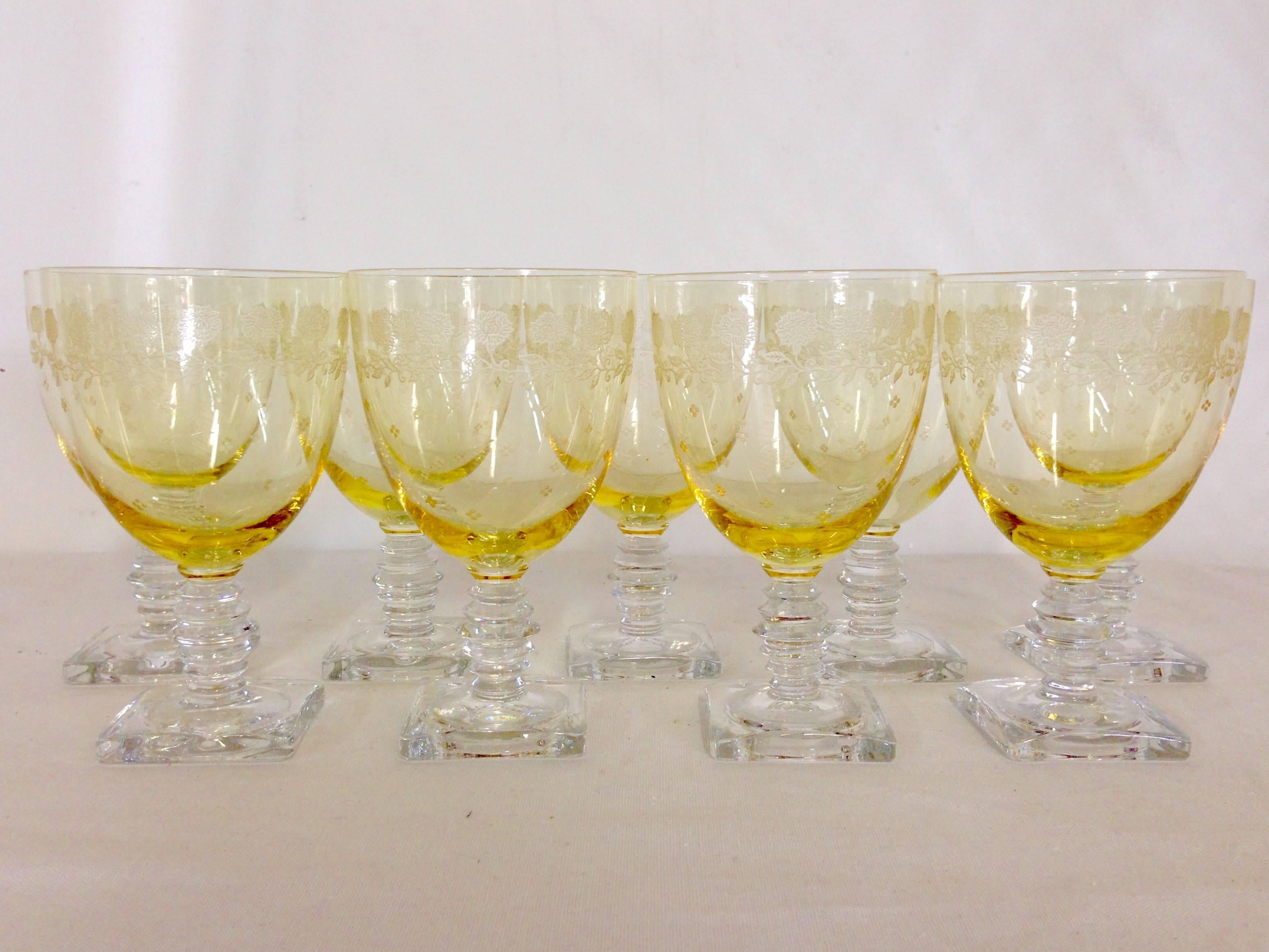 Set of nine Fostoria glass Co. etched yellow stem glasses, 