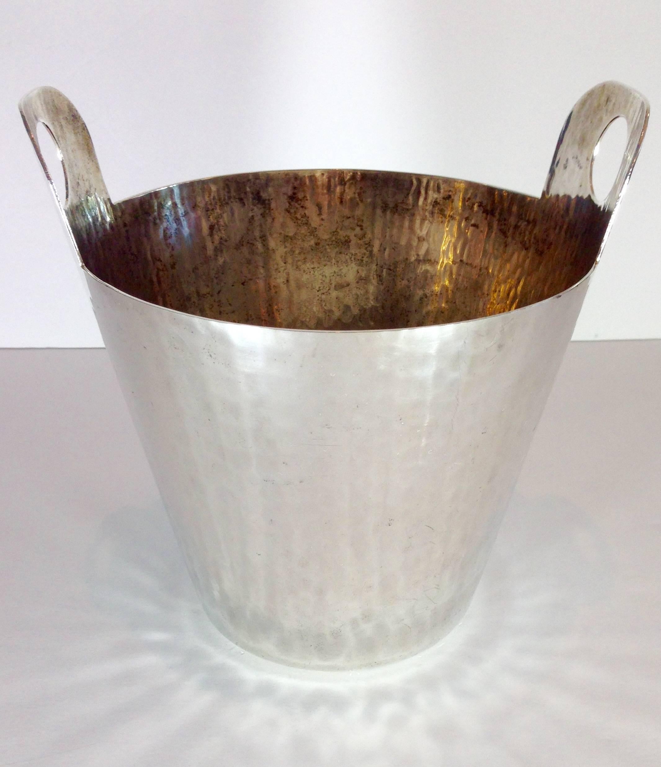 Italian hammered silver plate champagne bucket with cut-out handles. Signed on the underside, hand finished, Italy, Calegaro.
Monogrammed with previous owner’s initials.