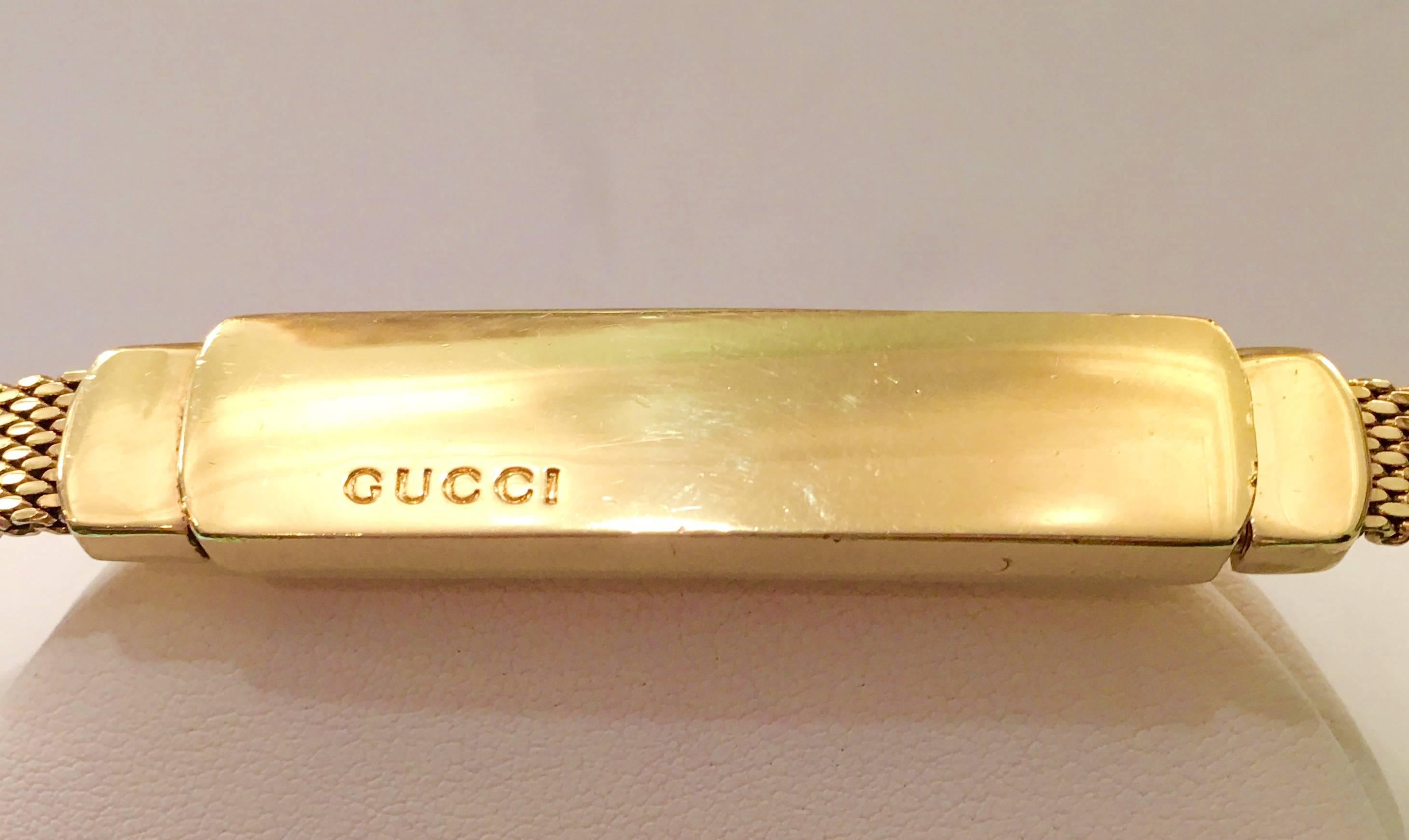 Gucci Tom Ford designed gold plate snake mesh clip buckle belt. Super rare, collectible belt from Tom Ford's days at Gucci. Made from heavy gold plate 'snake' mesh with GUCCI logo engraved on front of  buckle. Engraved on the back side of the