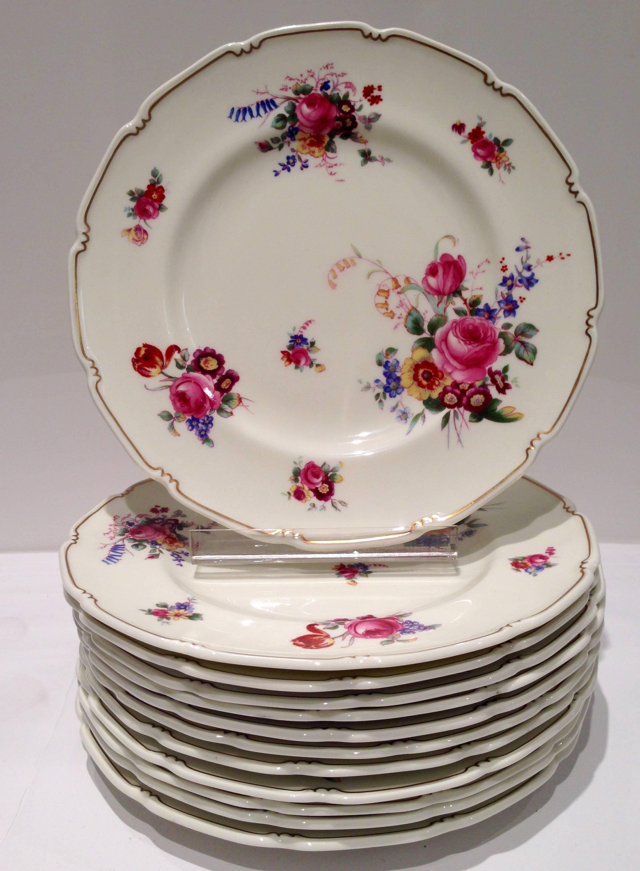 Set of 12 three-piece place settings of "The Bristol" by, Royal Doulton England bone china. This 36-piece rose motif set includes: 12 dinner plates, 12 salad/dessert plates and 12 bread/butter plates. Each pieces is back stamped with the