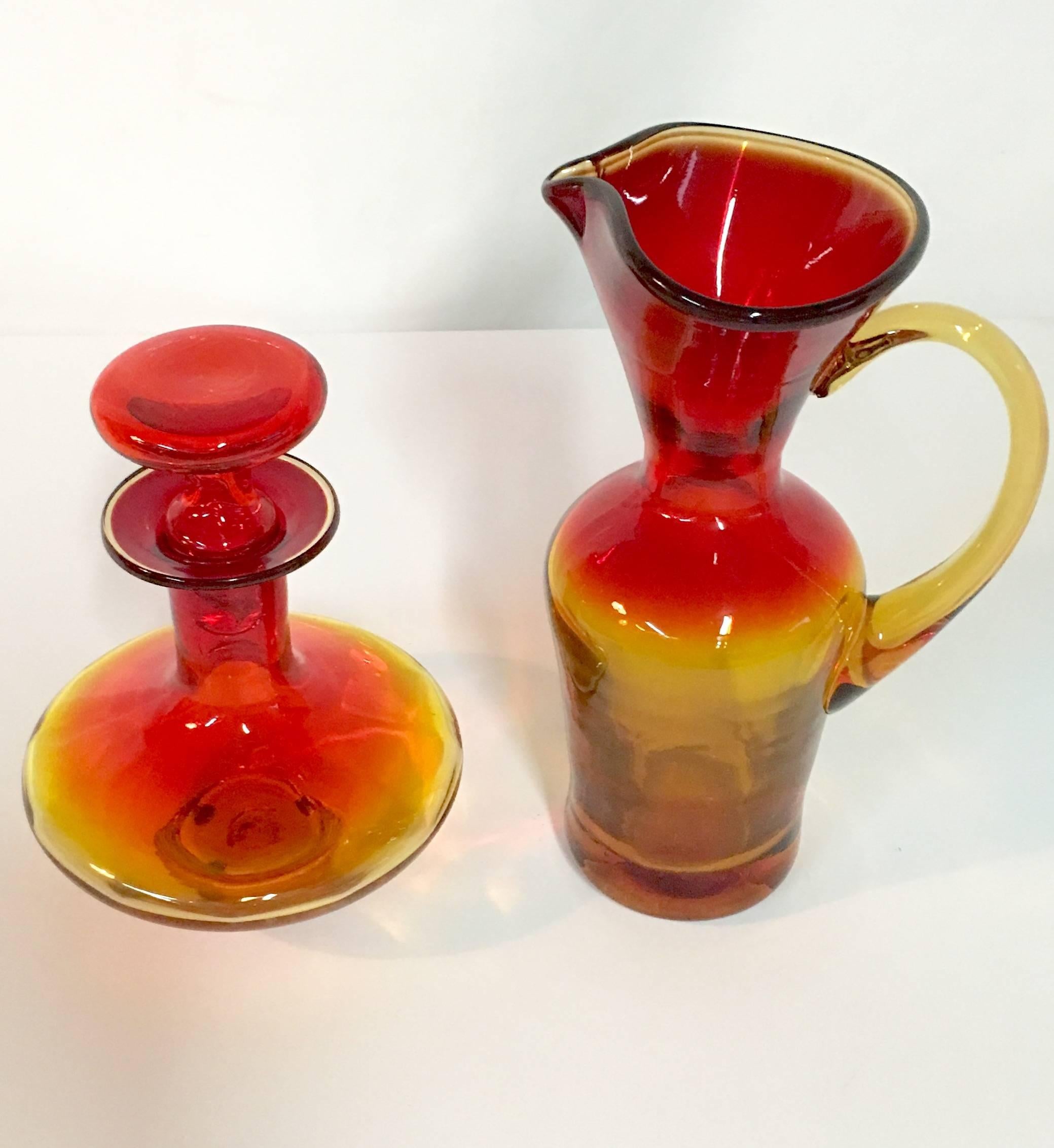 1950'S Blenko Glass Pair Of Amberina Tangerine handled pitcher & decanter with stopper. The pitcher has a hand applied handle with spout. The decanter is 