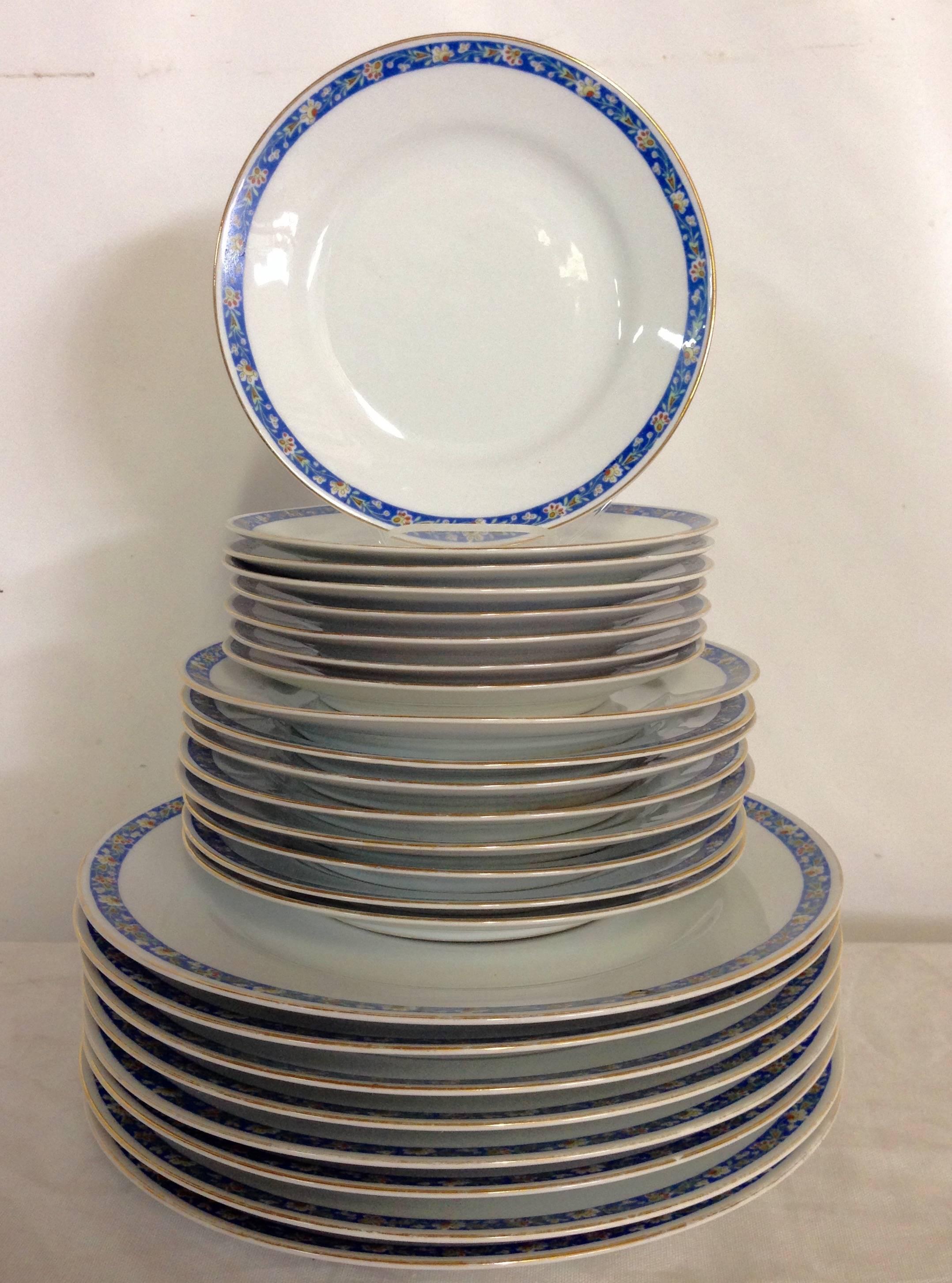 Mid-Century Japanese Morimura Porcelain dinnerware set of 24 pieces. This playful pattern features a bright white ground with a simple azure blue, yellow, white, red and green floral edge and a 22K gold rim detail.
Set consists of eight 3 piece