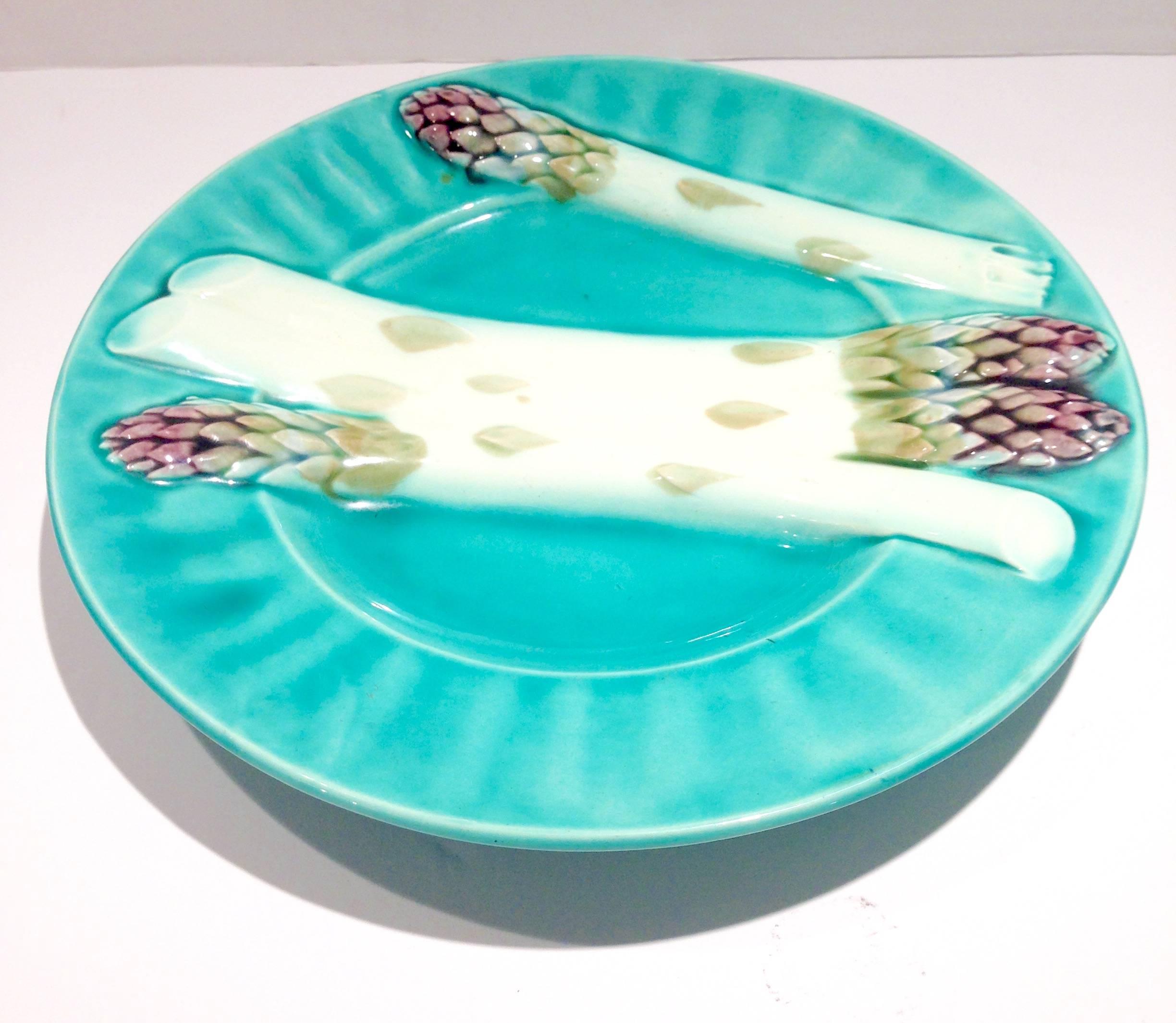 Early 1900'S Tturquoise French Majolica asparagus plate with white, green and purple asparagus relief design. Signed on the underside, Depose K et G Lunville.
