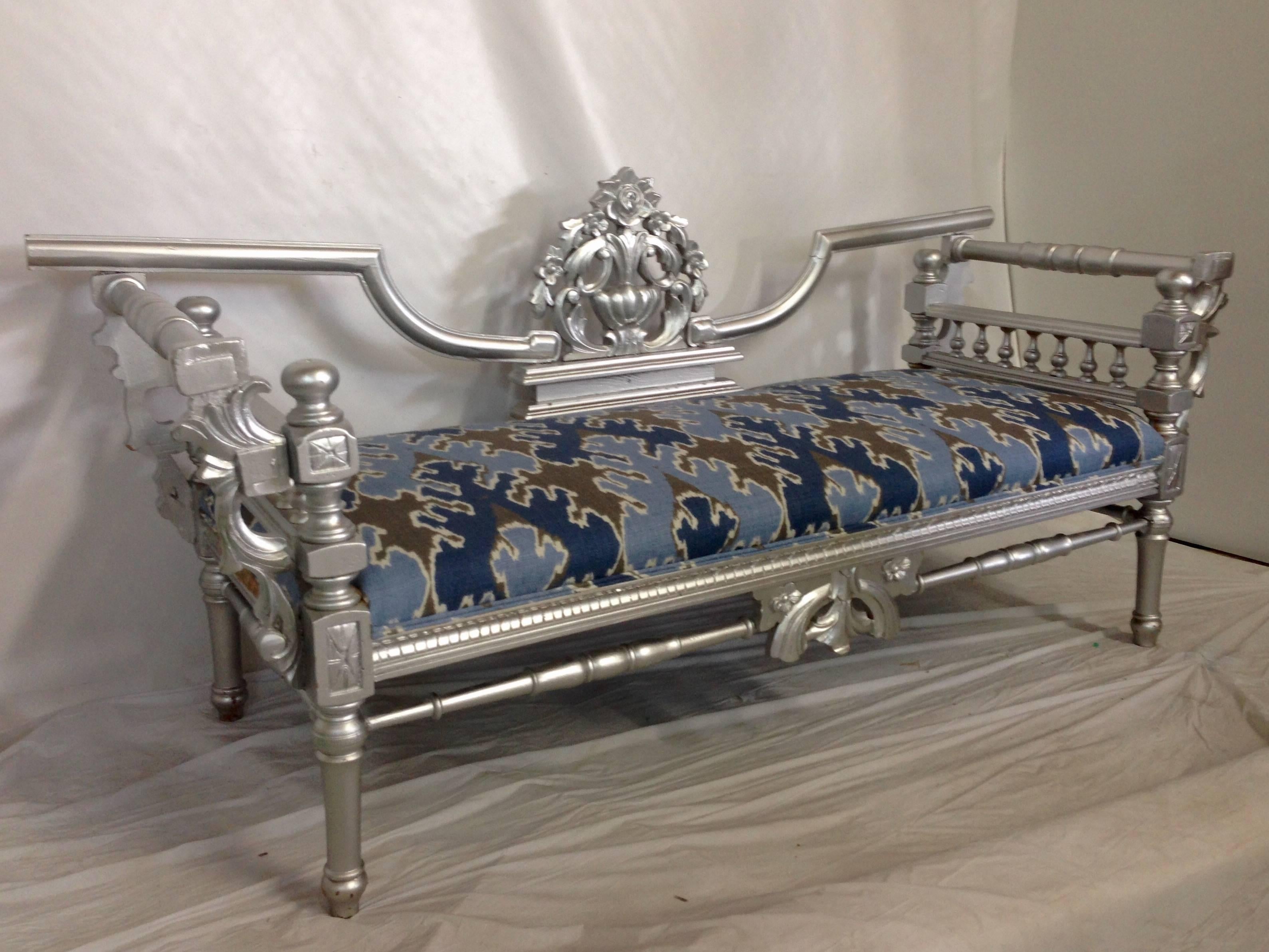 Early 20th Century newly upholstered carved wood lacquered metallic silver   daybed. New Ikat blue, periwinkle, grey and white linen fabric, designed by famed interior designer Kelly Wearstler for Lee Joffa. Heavily decorated rose and wreath motif