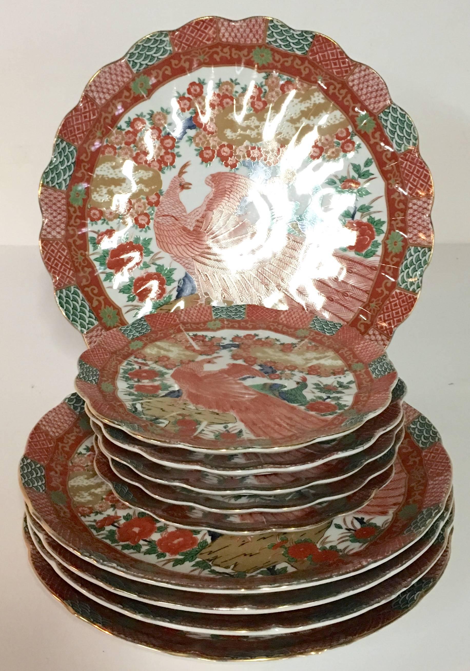 Set of ten Imari peacock plates with beautiful scalloped edge and 22-karat gold detail by, Arita, Japan plates. This hand decorated set includes one round platter, four dinner plates, 1.25
