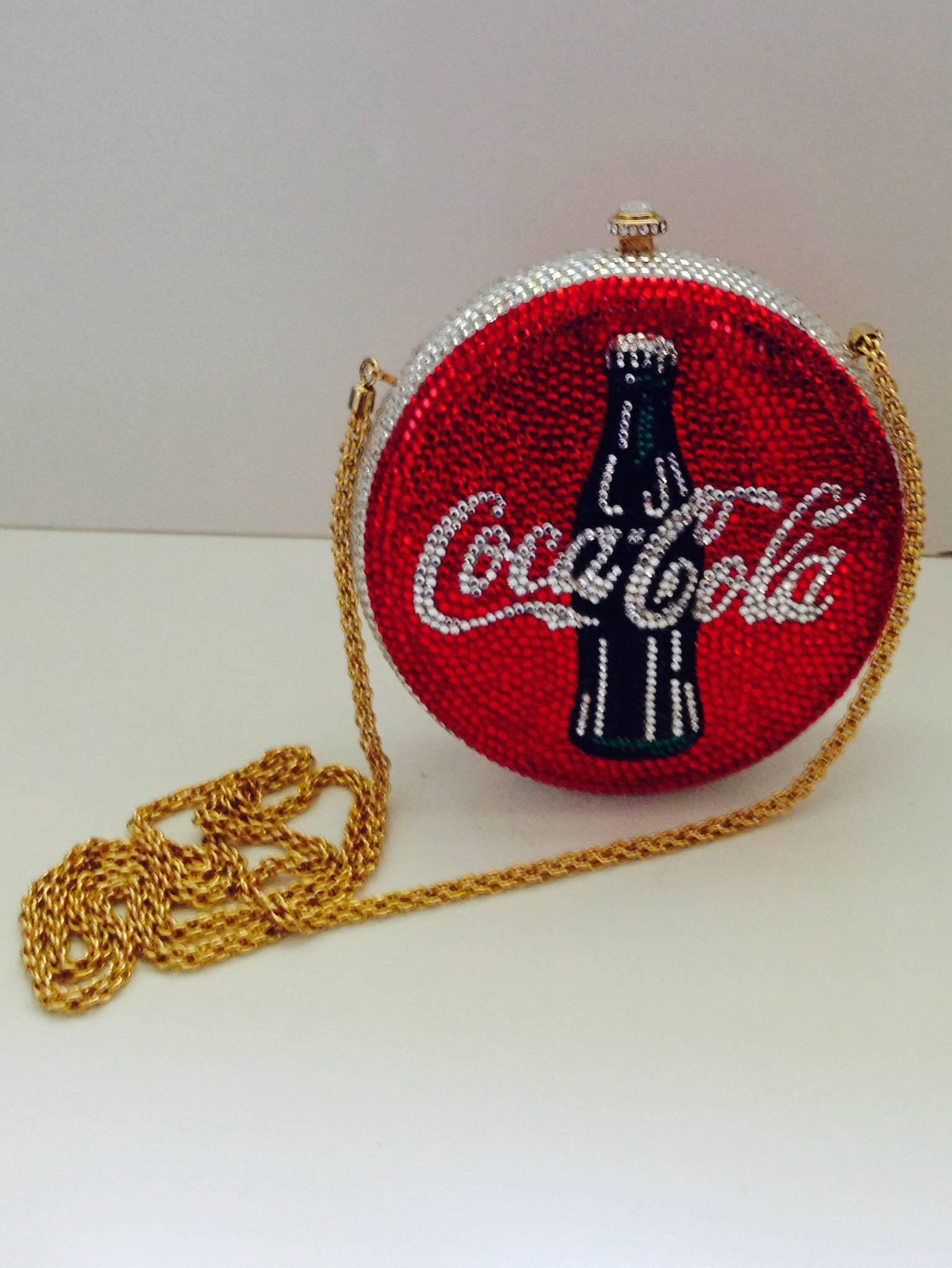 Limited Edition signed & numbered Katherin Baumann encrusted Swarovski crystal and gold-plate metal base Coca-Cola bottle cap minaudière evening bag. This limited edition bag is numbered via a brass plaque located on the interior of the hard