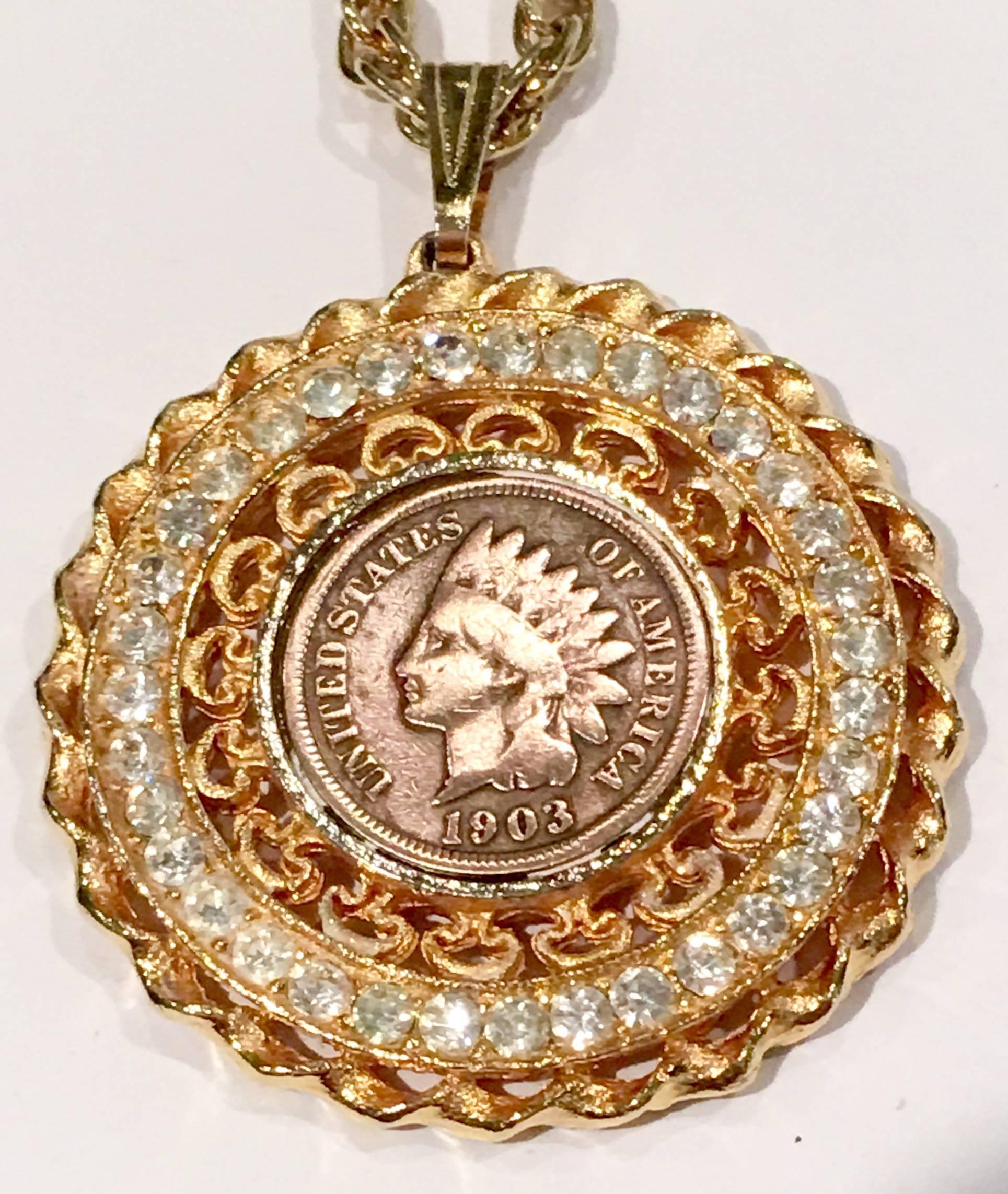 1903 Indian head penny surrounded by clear Swarovski crystals and gold plate filigree pendant necklace. The necklace is a 24