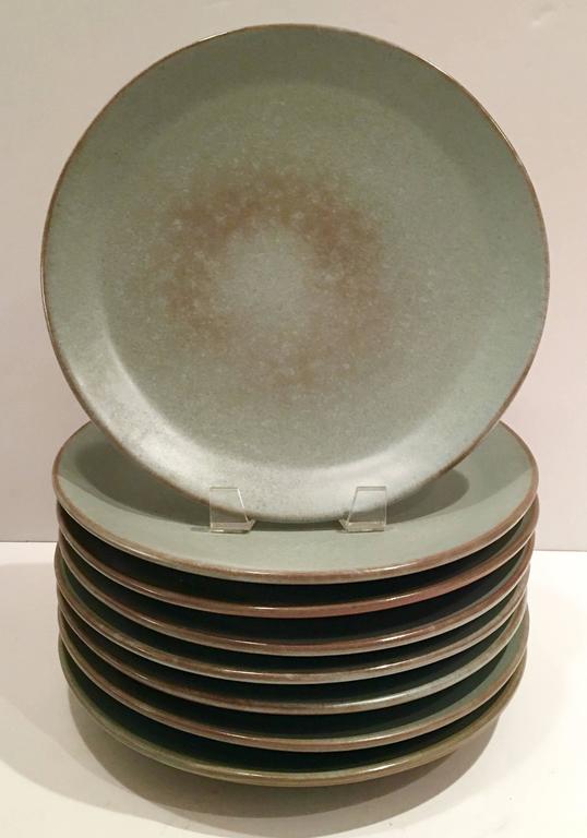 Quintessential 1950s Mid-Century pottery 29-piece dinnerware set by Frankoma Pottery. Set includes ten dinner plates, ten soup/cereal bowls and nine salad/dessert plates in Prairie Green. 
Soup/cereal bowl measures: 2