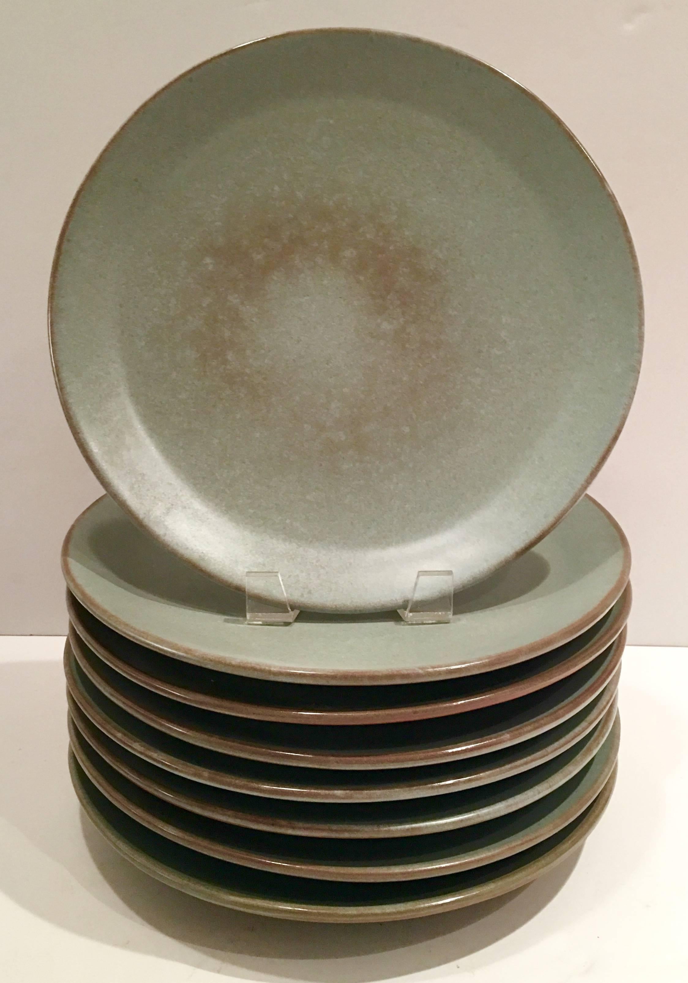 Quintessential 1950s Mid-Century pottery 29-piece dinnerware set by Frankoma Pottery. Set includes ten dinner plates, ten soup/cereal bowls and nine salad/dessert plates in Prairie Green. 
Soup/cereal bowl measures: 2