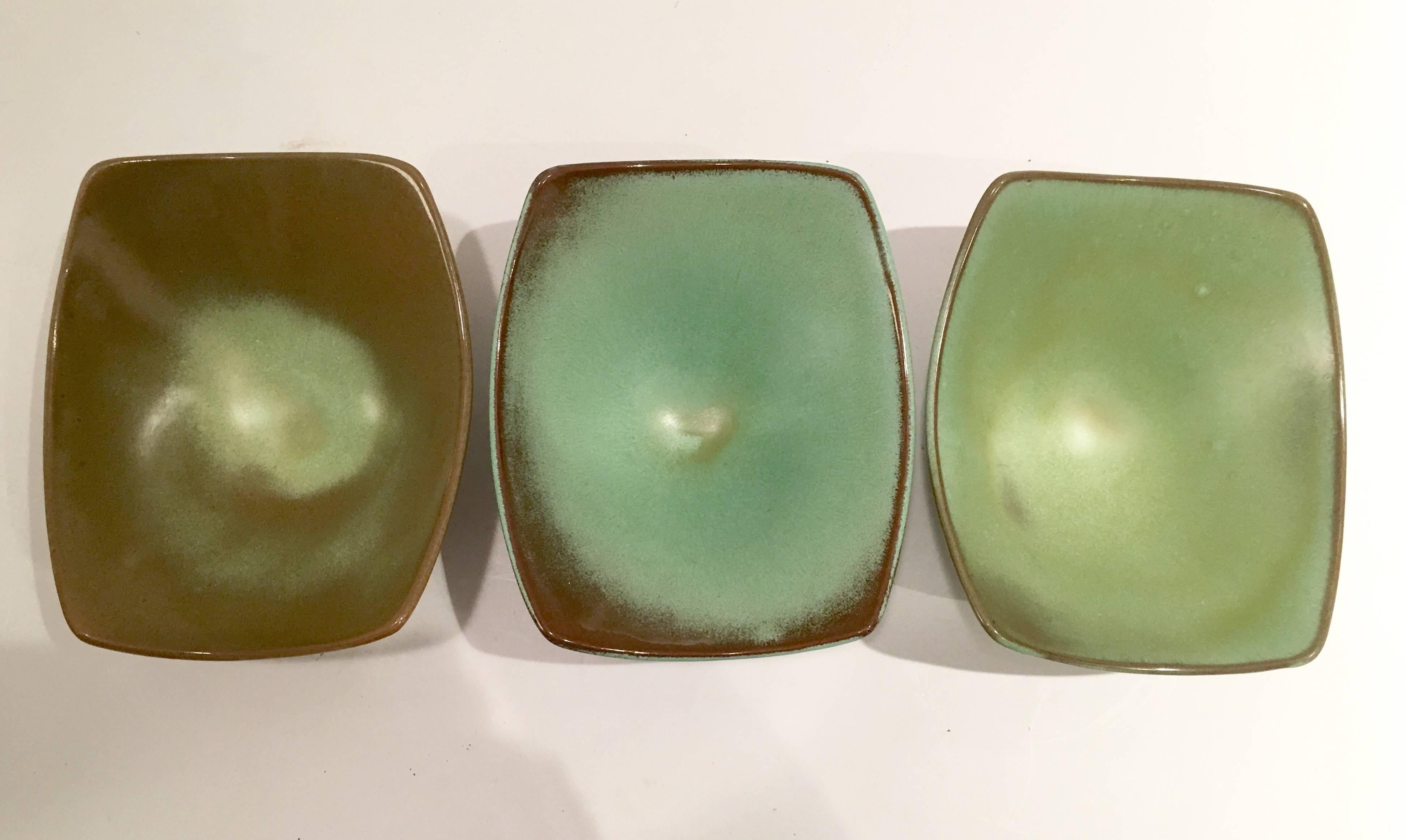 1950s Frankoma Pottery green five-piece serving piece set. Set includes, three square serving bowls, one oval serving platter and one leaf serving platter. 
Each bowl measures, 3.75" H x 7.75" L x 5" depth. The leaf tray measures,
