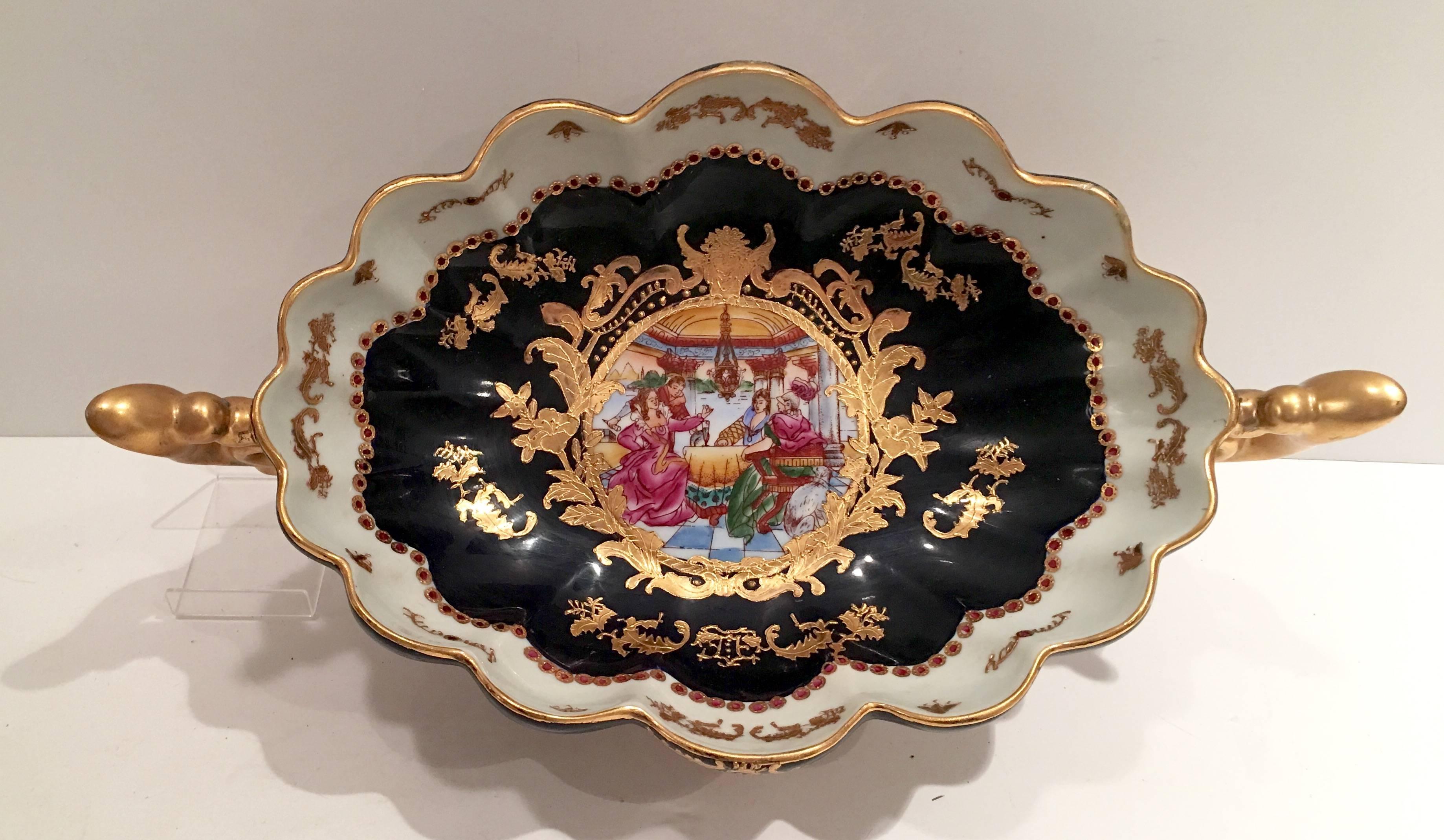 Vintage hand-painted porcelain center bowl with 22-karat gold gilt handles gold raised detail. Signed on the underside Sevres 2.
