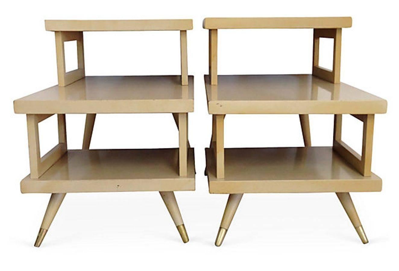 Quintessential & Rare Pair Of of Mid-Century Modern blonde three tier side tables with brass ferrule feet. Made of blonde wood, each top is laminated formica in high gloss finish