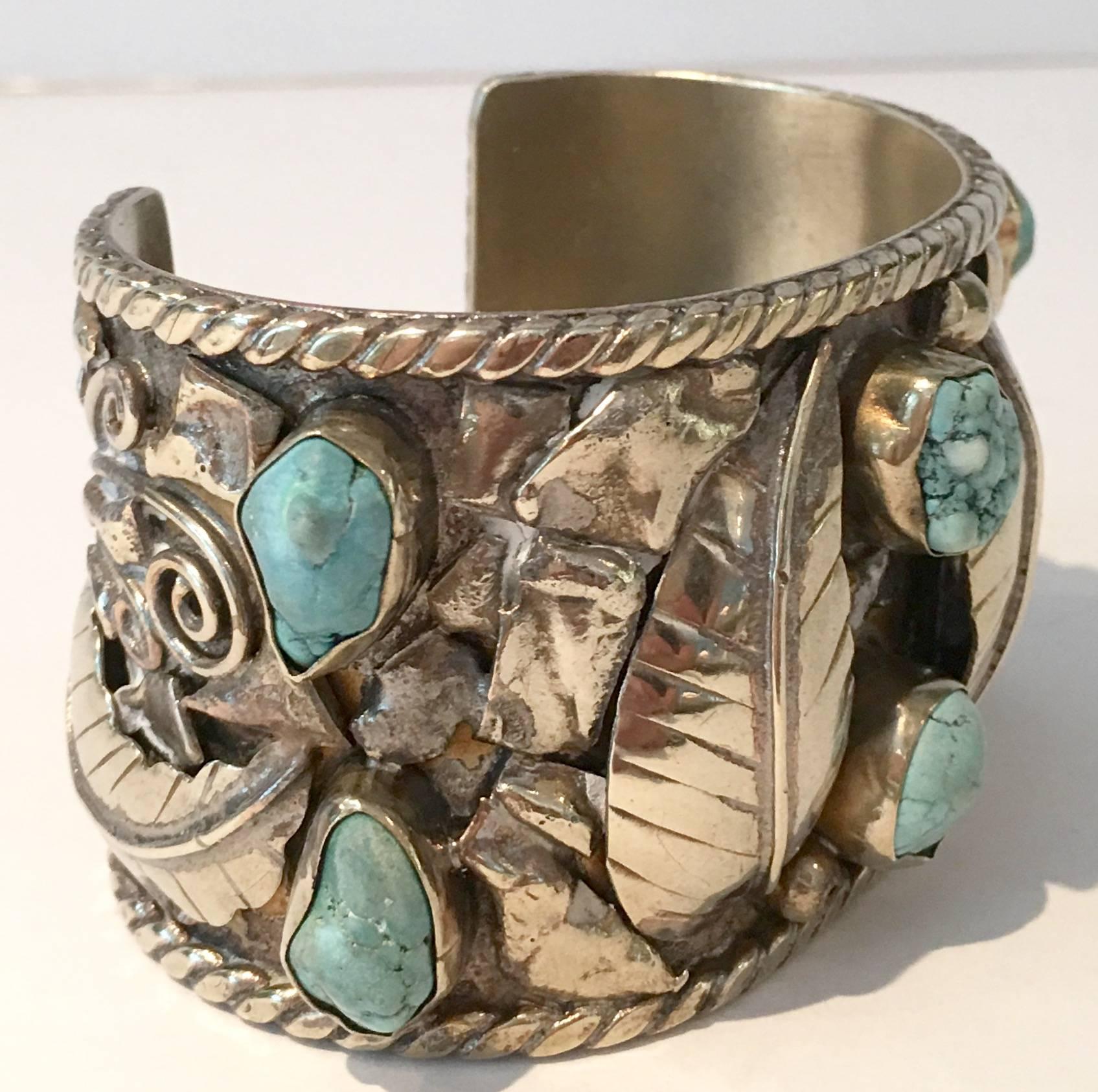 Incredible and unique Mid-Century Native American sterling silver and six turquoise cabochon set stones over nickel silver cuff bracelet. Each turquoise stone is approximately. Measures: 25-.50