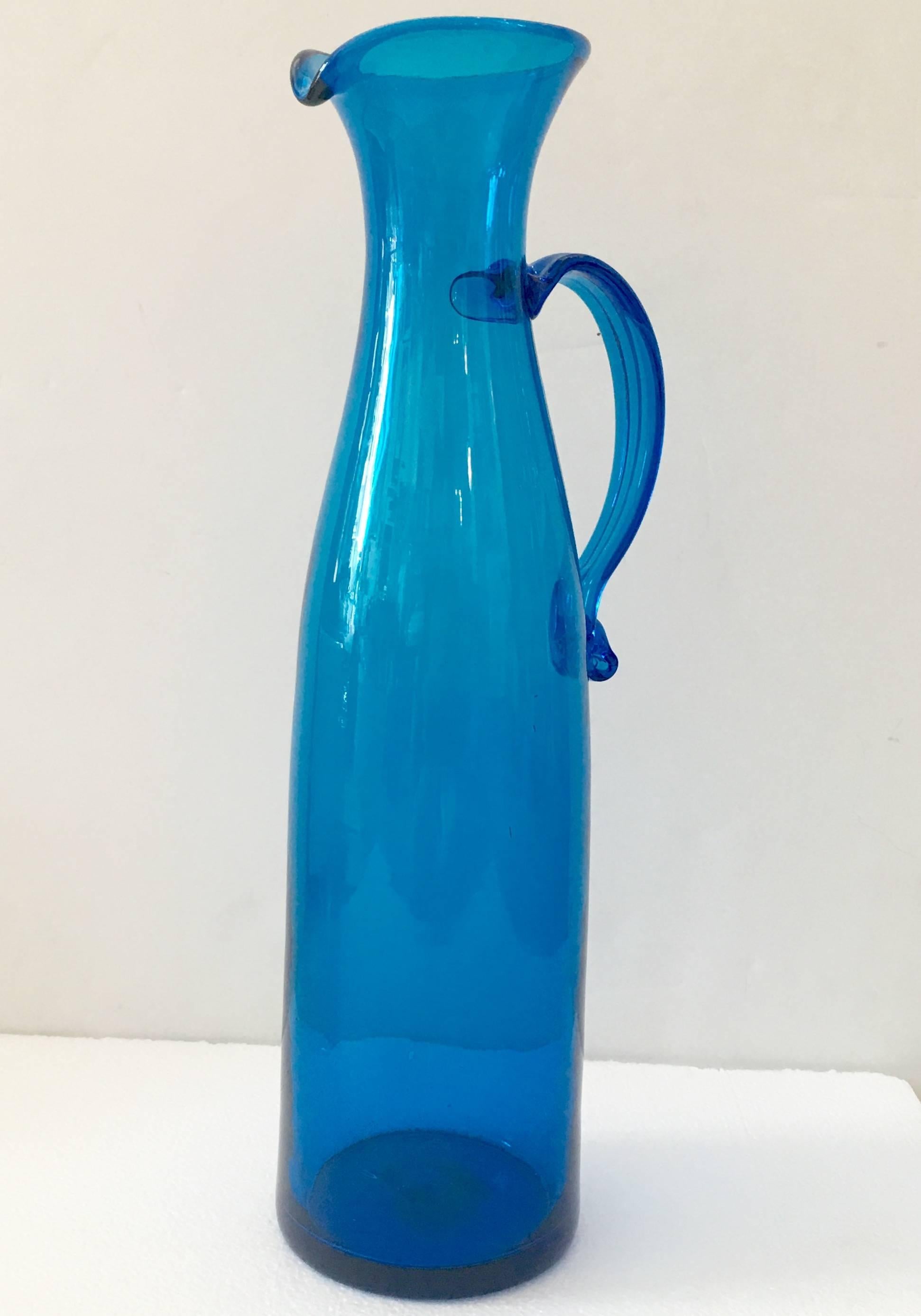 Wayne Husted 1970'S design tall  & over sized Blenko Glass applied handle tall spouted pitcher for Blenko Glass. Height 18.75" inches.