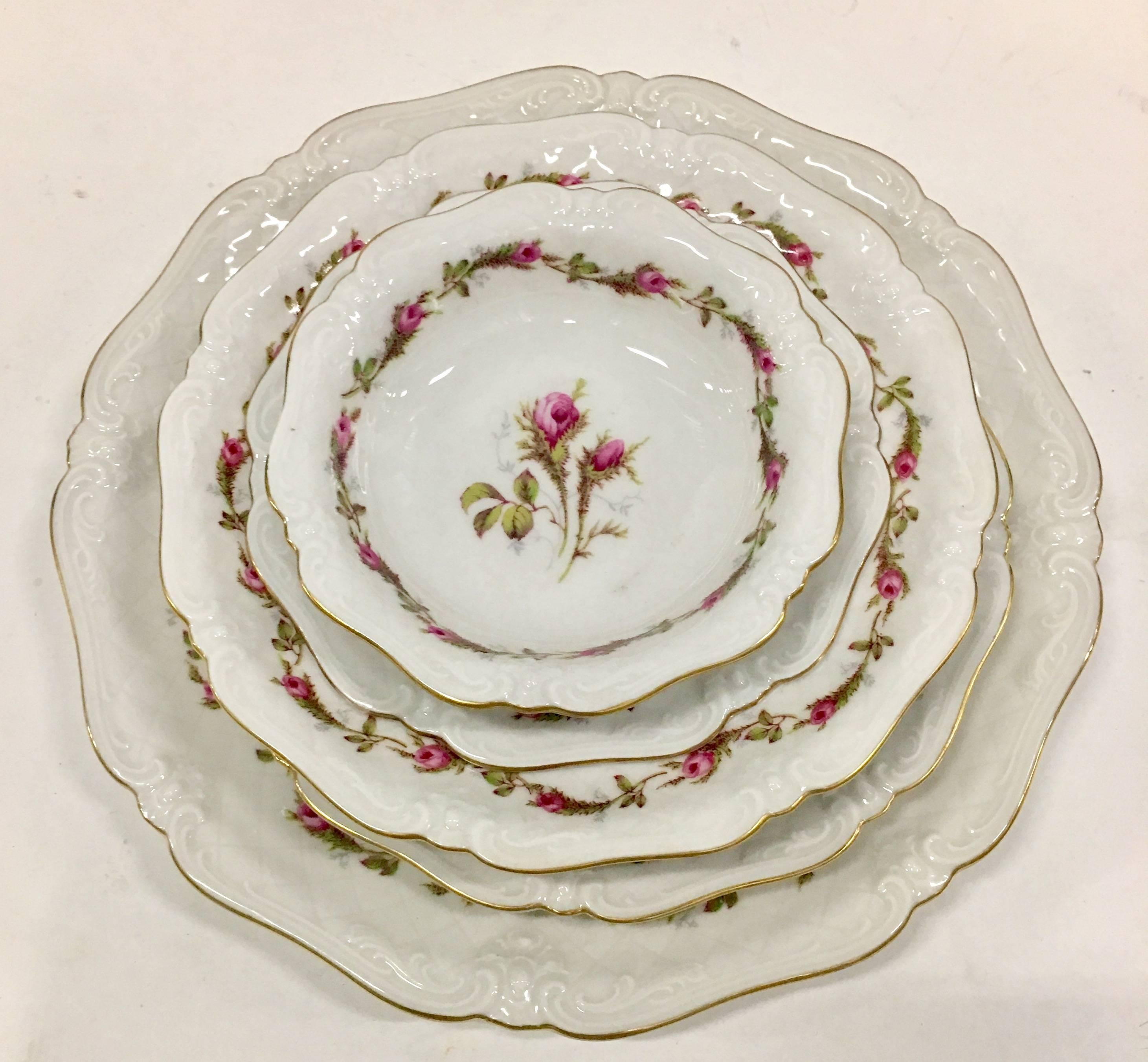 Vintage Bavaria porcelain thirty five piece set of "Moss Rose" or "La Reine Meiss" porcelain china by, Eschenbach Bavaria Germany. Pattern features a white ground with bright pink and green moss rose pattern and 22-karat gold