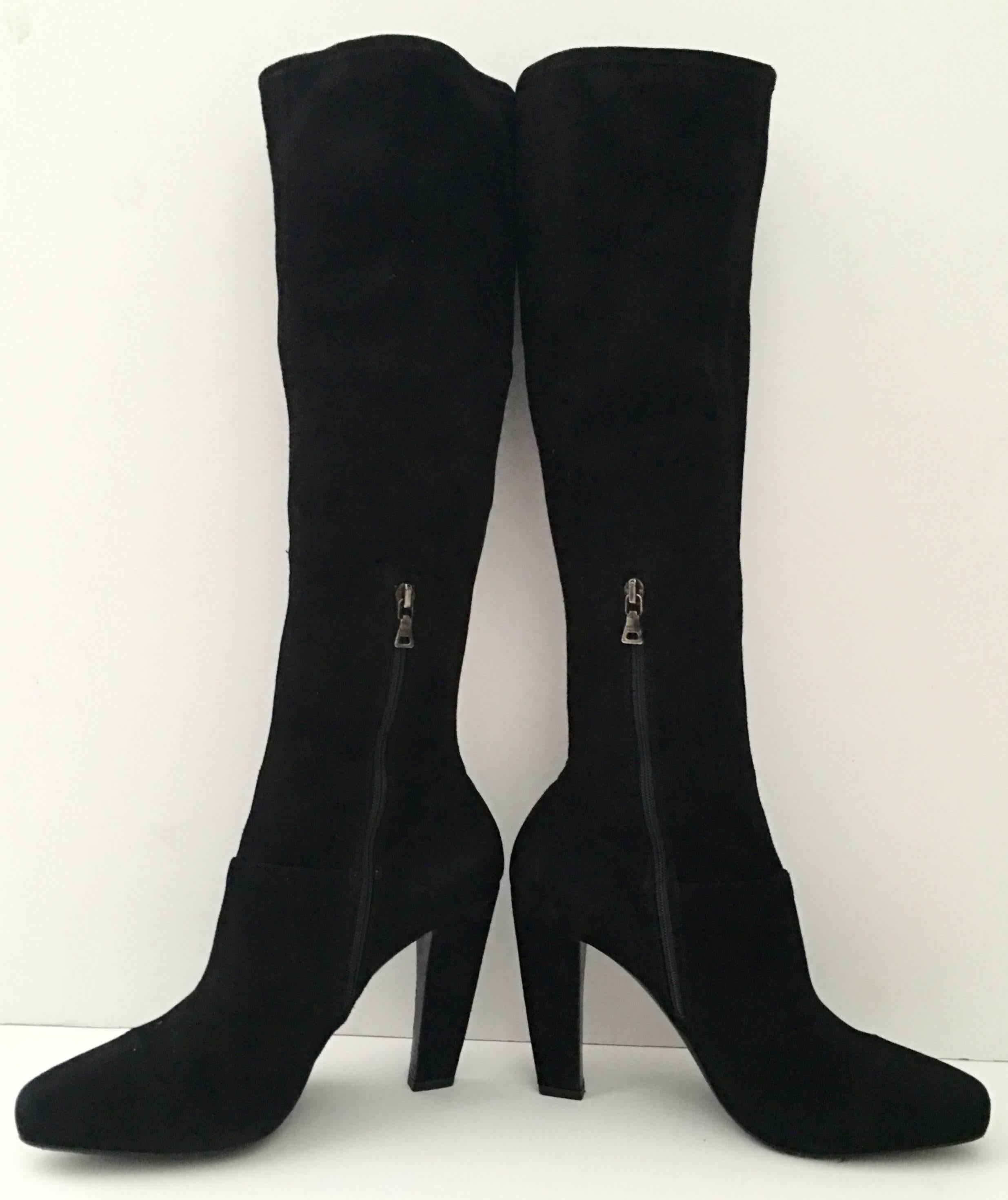 2012 Fall collection Prada black suede square heel boots. Prada quality soft, supple, with a bit of stretch falling just at the bottom of the knee. Soft pointy toe with a curved square high heel, these boots are a great neutral for any occasion.