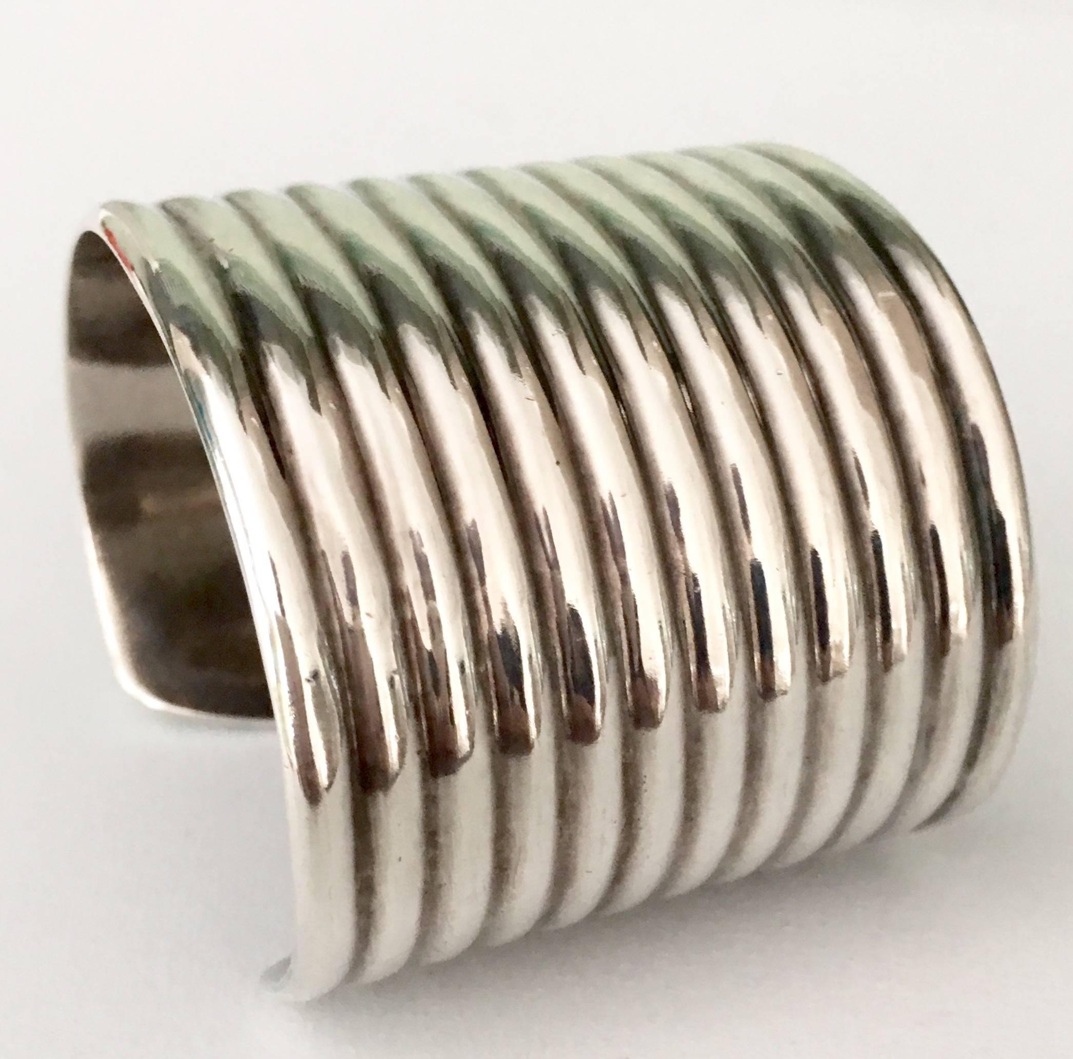 Classic sterling silver 12 strand cuff bracelet. Signed on the underside, 850 TN-01, Mexico. Total weight, 86 grams. Opening measurement is 1.13