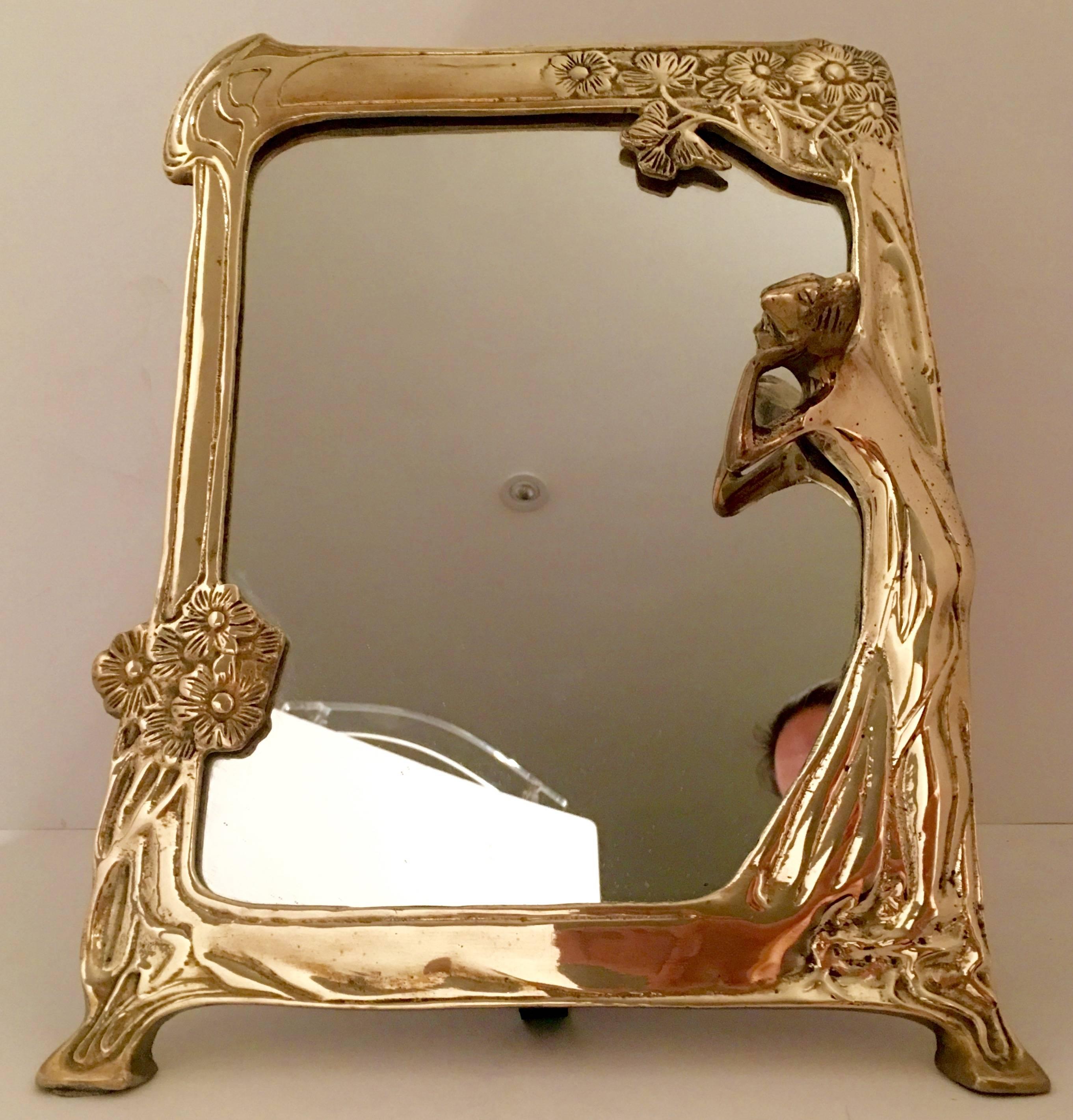 Art Nouveau style solid brass Lady Reflection Mirror. Easel frame style with velvet backing.