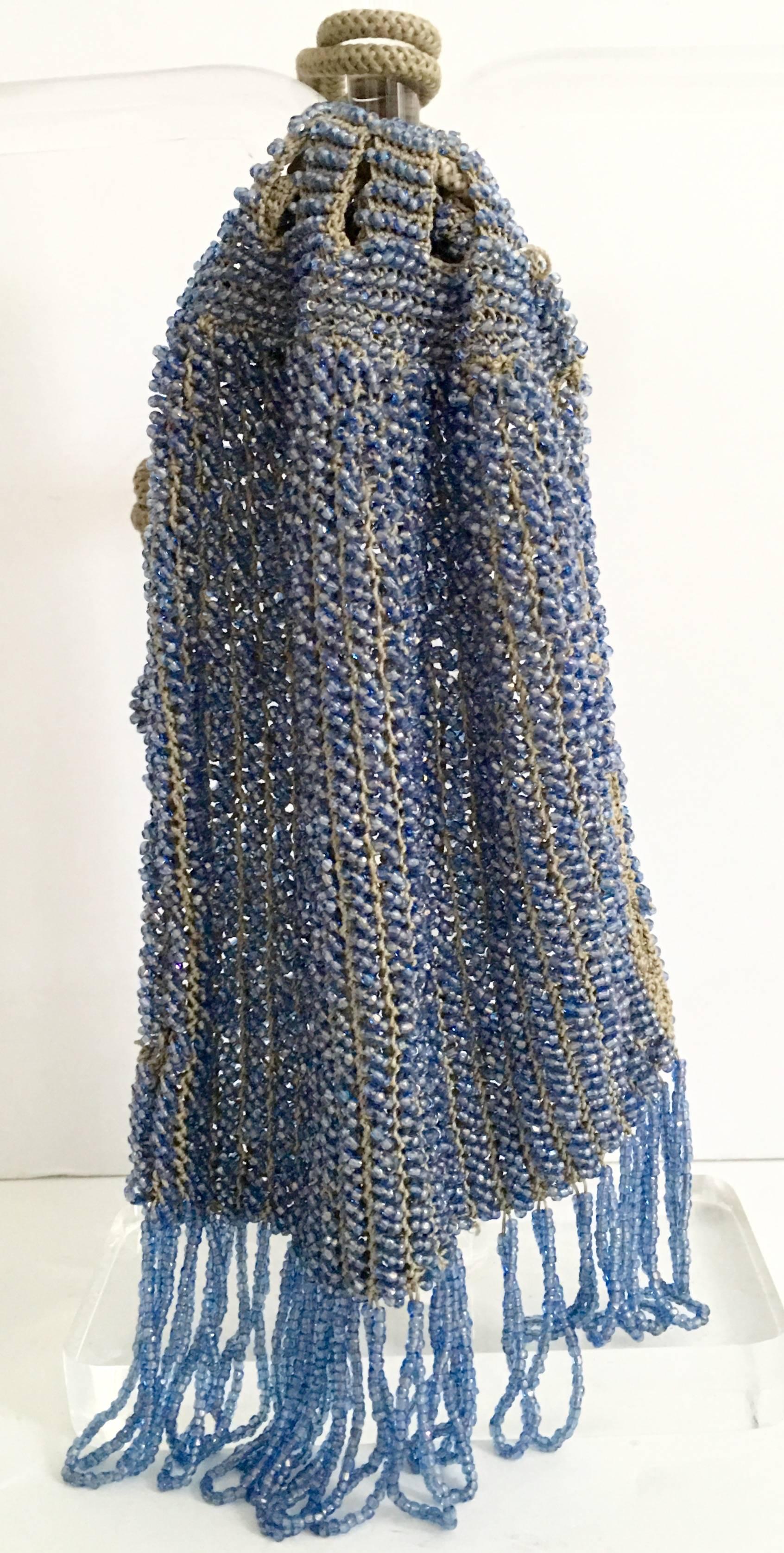 Gorgeous handmade and blue crystal bead drawstring flapper style evening bag. Accommodates a large cell phone.