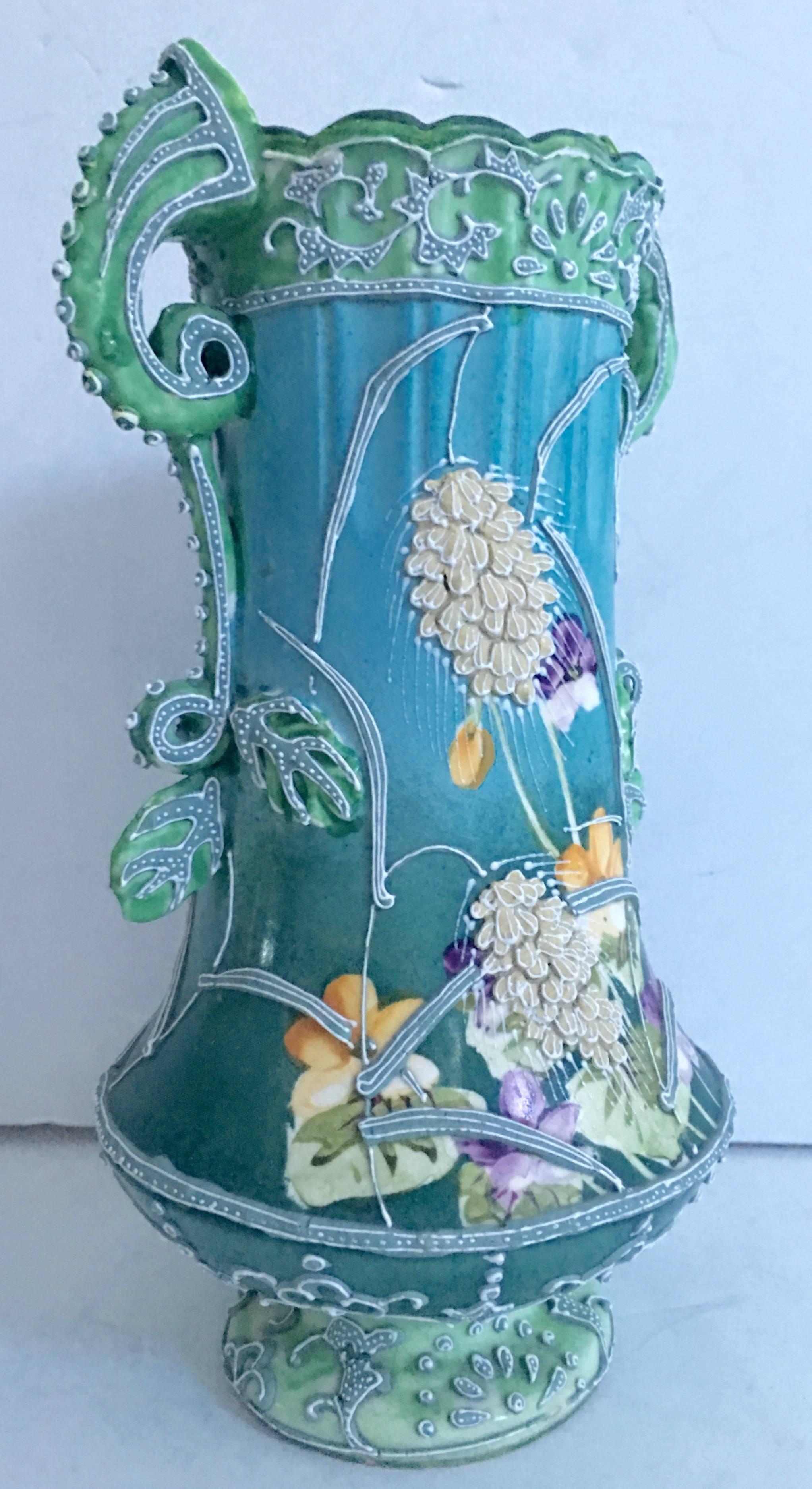 Exquisite Art Nouveau museum quality 19th century "Moriage" style floral motif double handle vase by, Nippon. This early piece of Nippon is unsigned, common for this era of production. Turquoise and green with bright floral design and