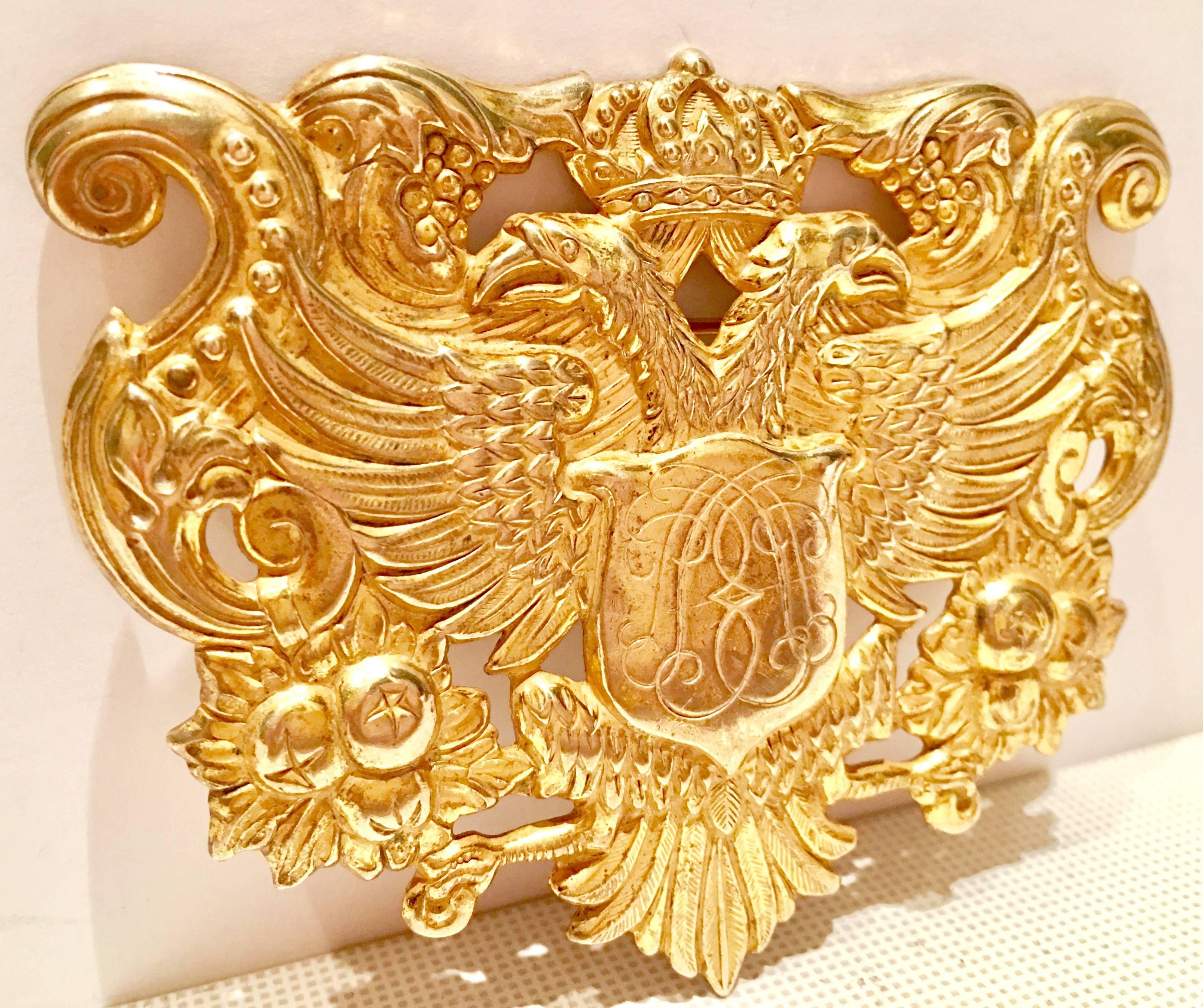 Rare large signed Miriam Haskell 22-karat Russian gold crest phoenix coat of arms shield brooch pin. Signed, Miriam Haskell on the backside. Total weight,
18 grams.