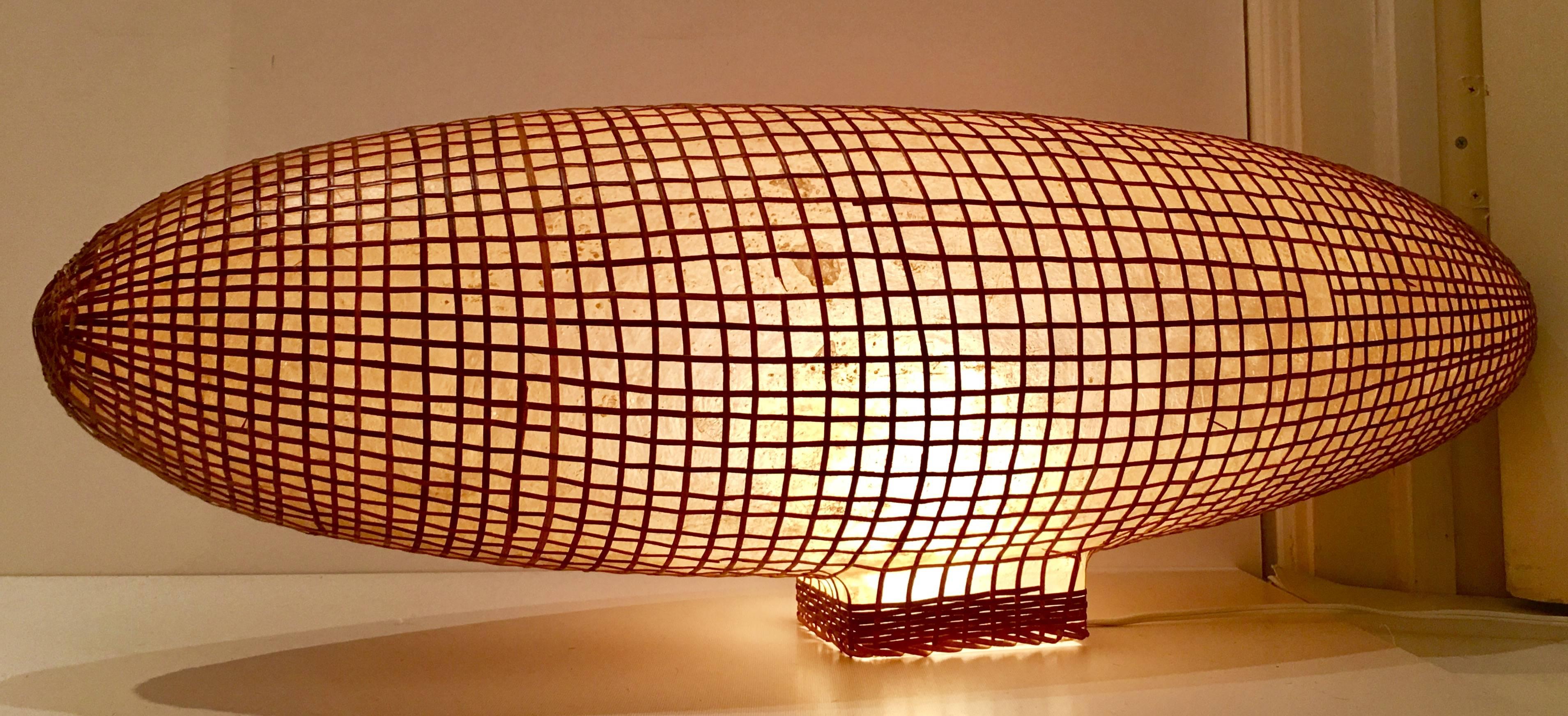 Incredible & unique Mid-Century Japanese made wrapped rattan over a solid and hollow fiberglass model of a 