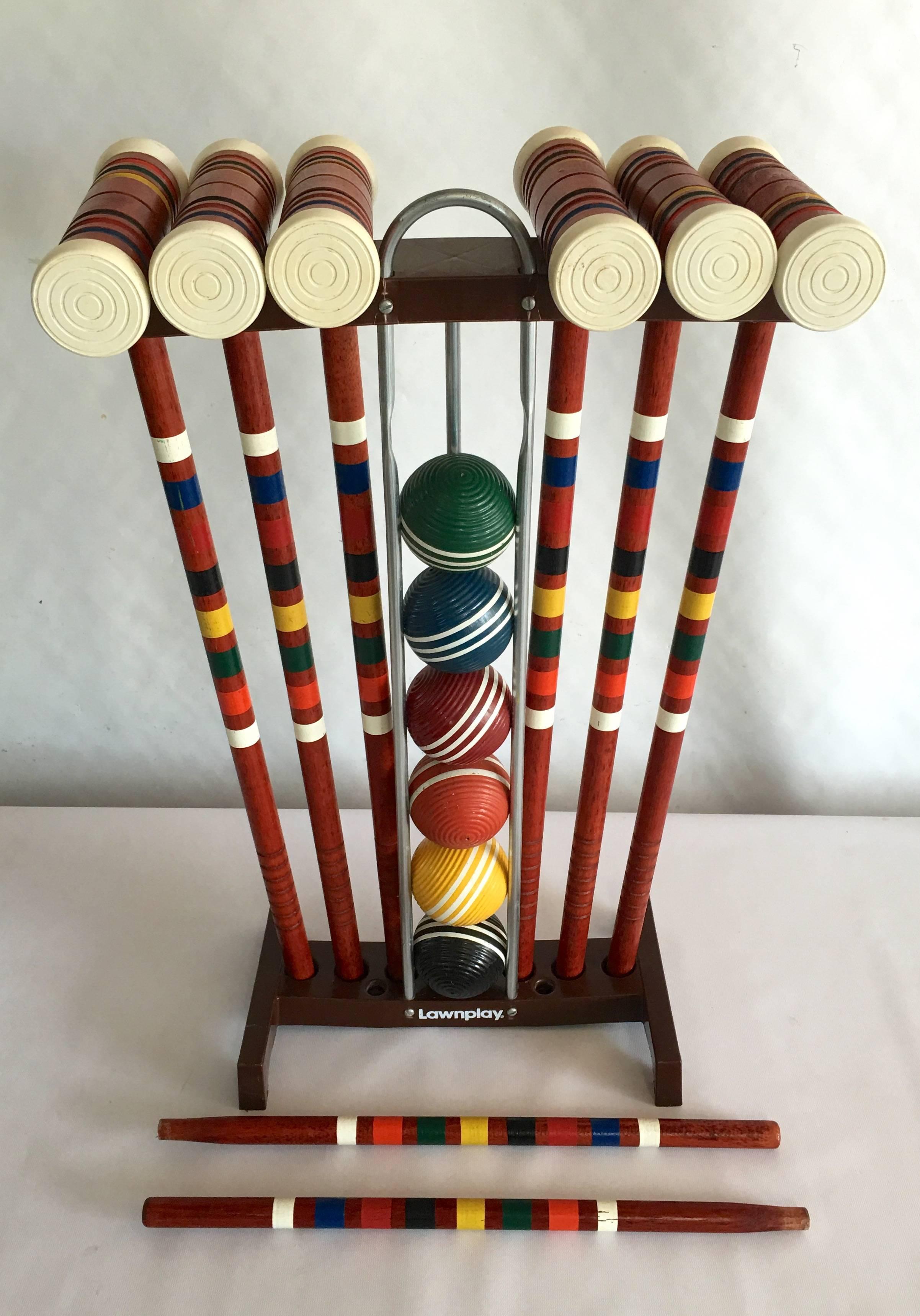 Vintage lawnplay six-player complete 24-piece croquet set. Set includes, six wood mallets, six painted wood balls, two wood marker sticks, nine vinyl coated wire wickets, and stand.