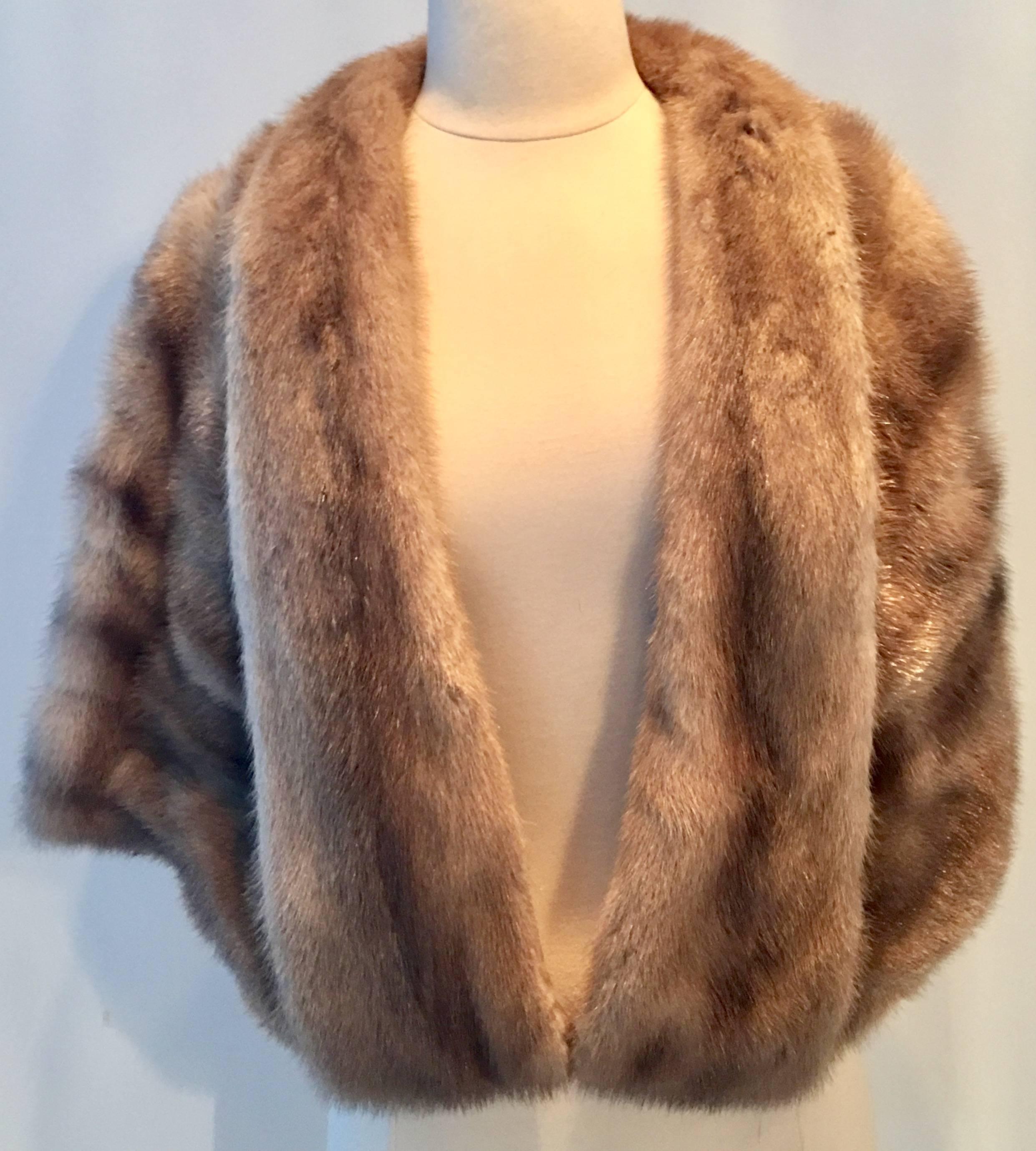 Mid-Century taupe and brown mink fur capelet jacket. Features shawl collar, fully lined. Furrier tag for Arnold Liebes San Francisco intact. Size - one size.