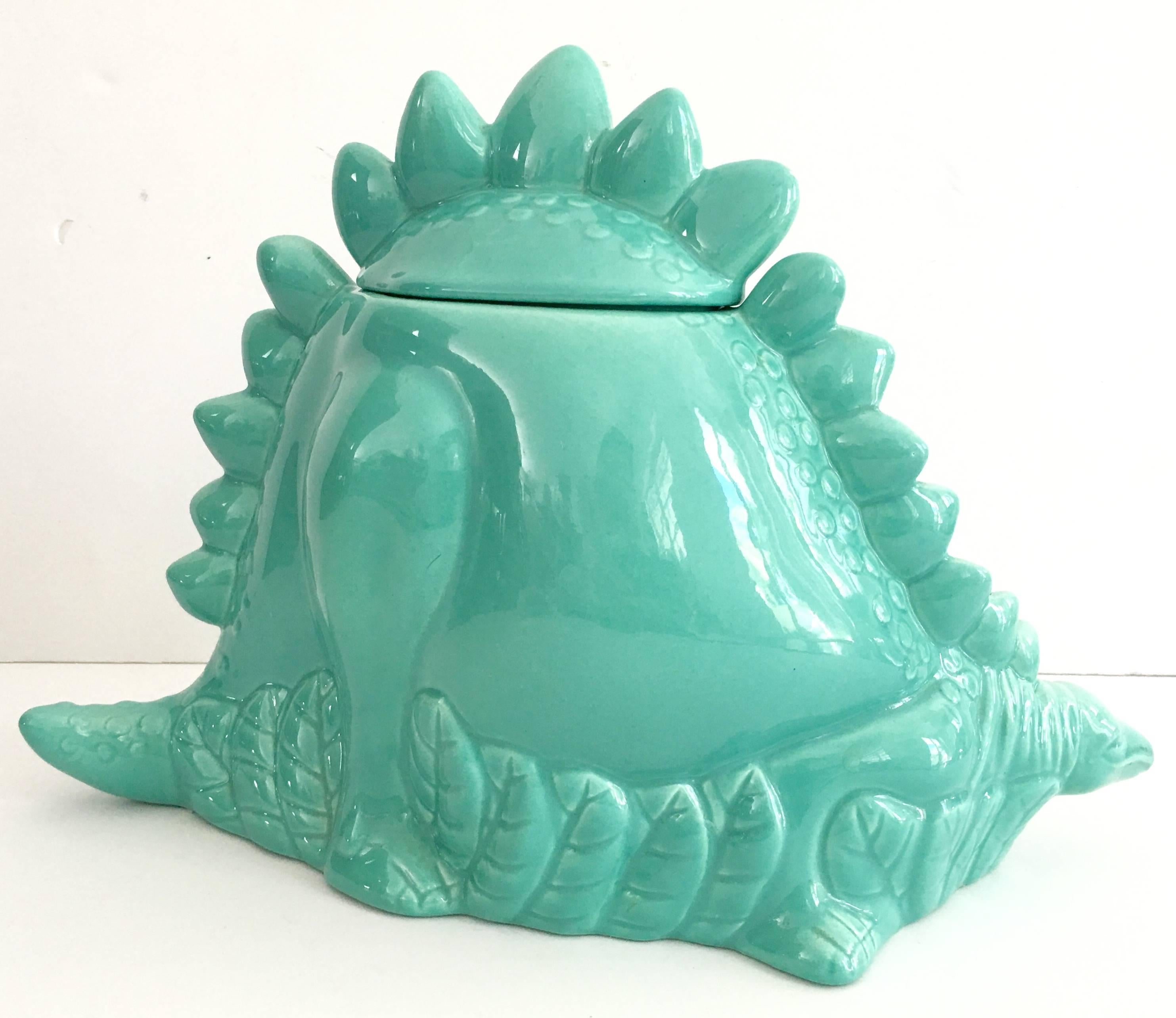 Metlox USA coveted and extremely rare turquoise ceramic large dinosaur lidded cookie jar. Signed on the underside by Metlox in house artist, 