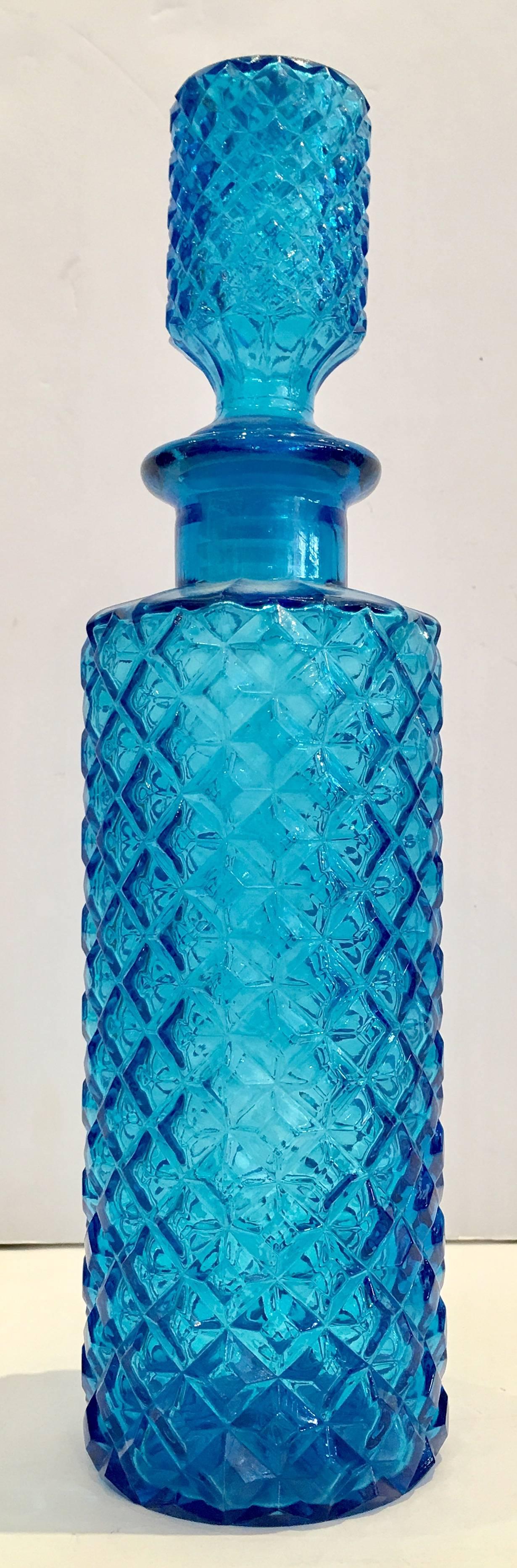 1970s pair of Italian Empoli Azure blue diamond cut-glass decanters with stoppers. Each stopper has a twist ribbed plastic stopper.