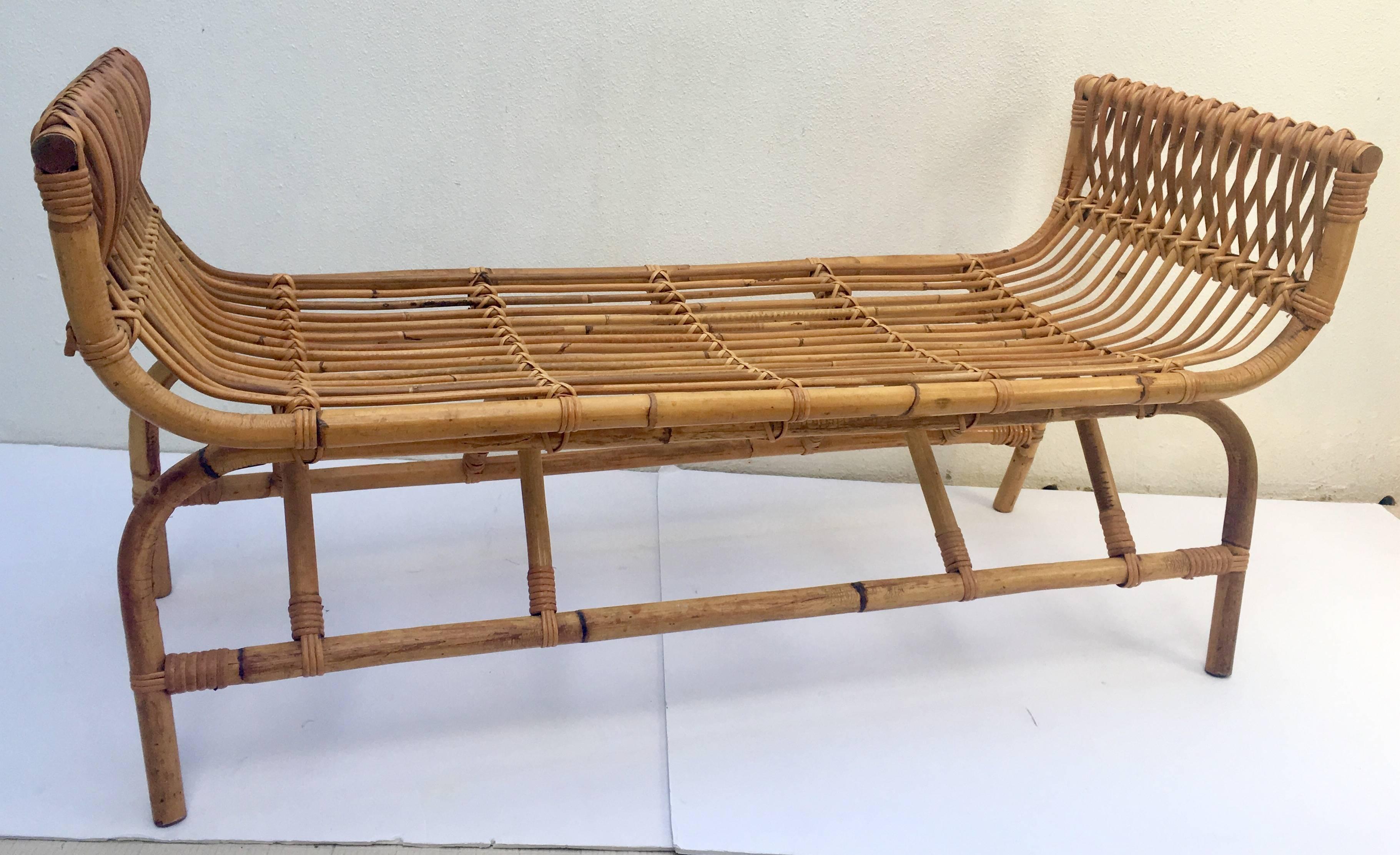 Mid-Century curved end rattan long bench. Includes a button tufted top cushion in brown cotton. The cushion is in great condition and has ties to hold it in place. The fabric can easily be changed for a more modern aesthetic.