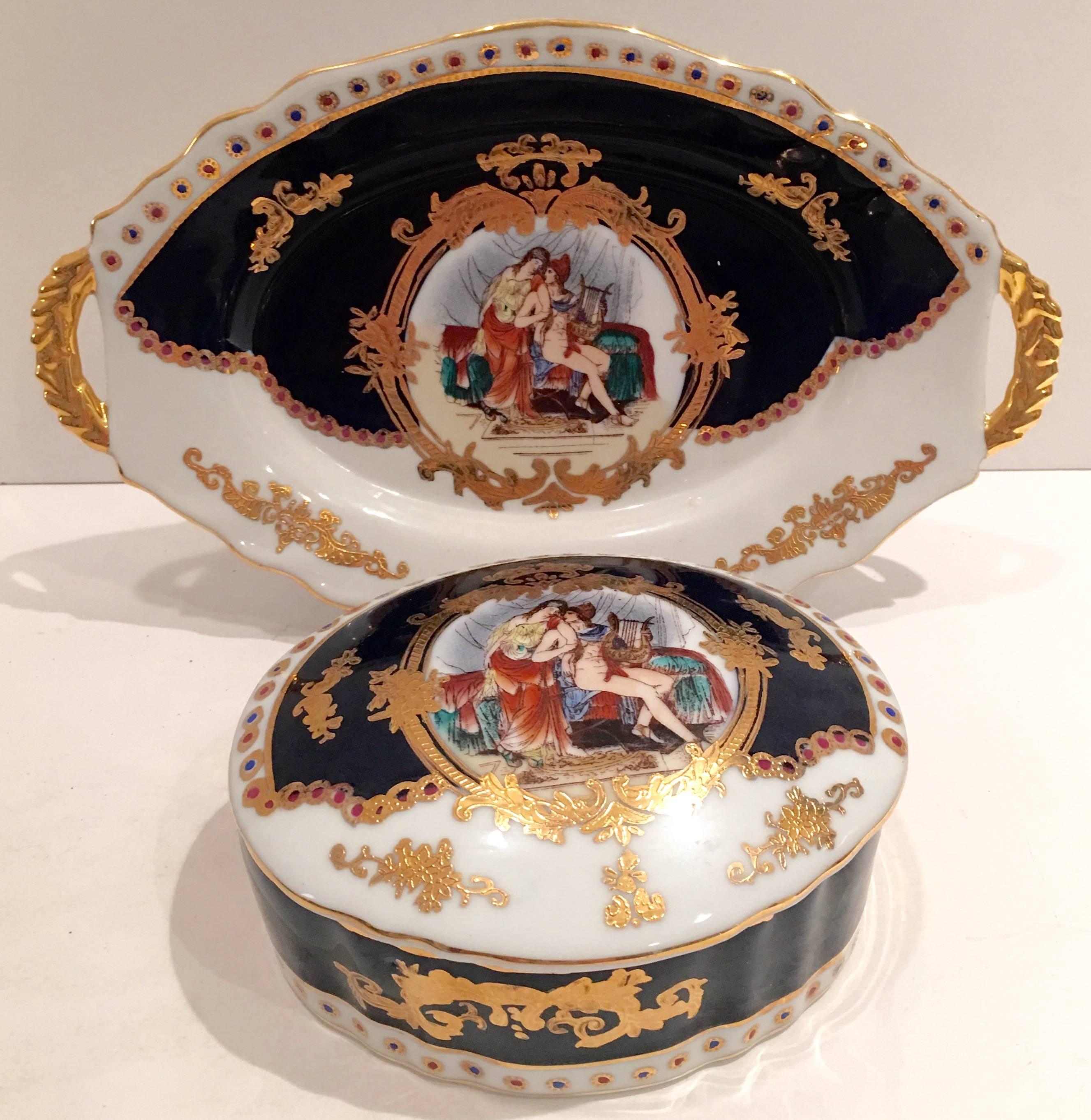 Mid-Century French Limoge Sèvres style hand-painted with 24-karat gold detail lidded box and handled tray. This three piece set features a courting couple lounging on a daybed.
Hand-painted on a bright white ground with cobalt blue and 22-karat