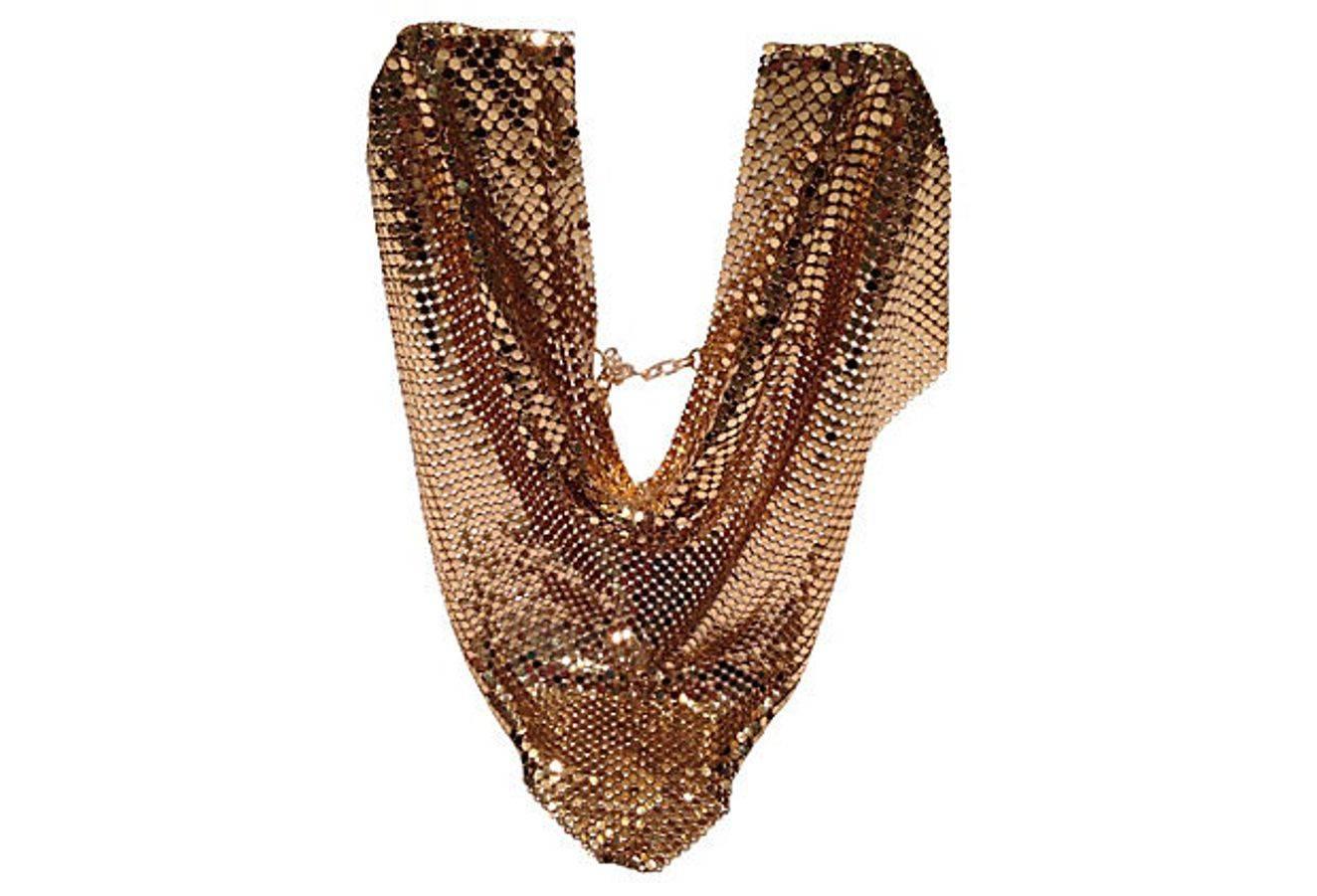 This shimmering coveted and reversible "hot now" gold metal mesh Bib choker necklace by, Whiting & Davis is a must have fashion staple! Dress it up or dress it down, there is nothing it won’t compliment. With an adjustable hook