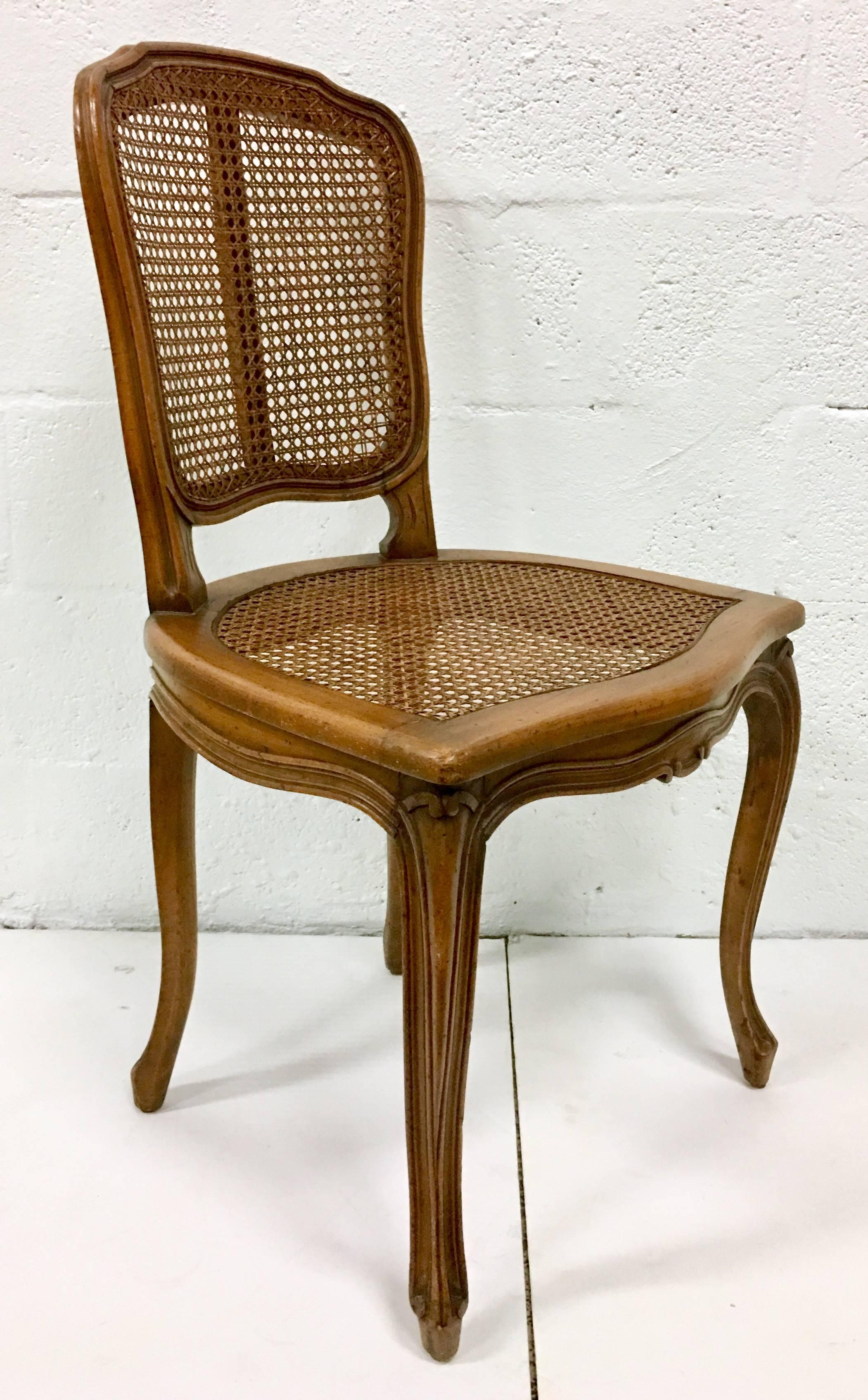 Mid-Century Pair Of French Style Carved Wood & Cane Chairs In Good Condition For Sale In West Palm Beach, FL