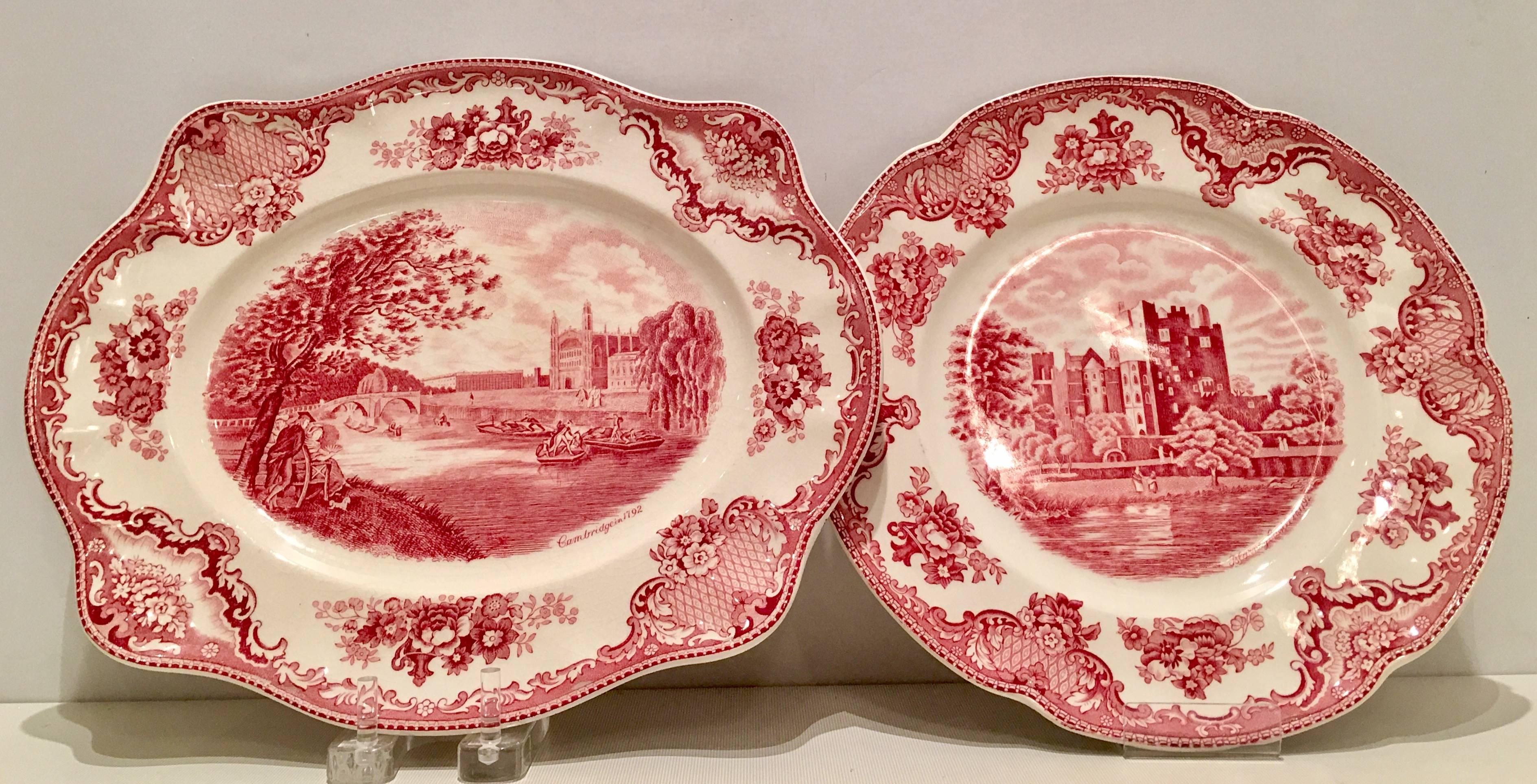1920'S English transferware "Old Britain Castles" in pink. This eleven piece set includes, one oval serving platter, four dinner plates, four rim soup bowls and two bread plates. Each piece has the red crown Johnson Brothers crown back