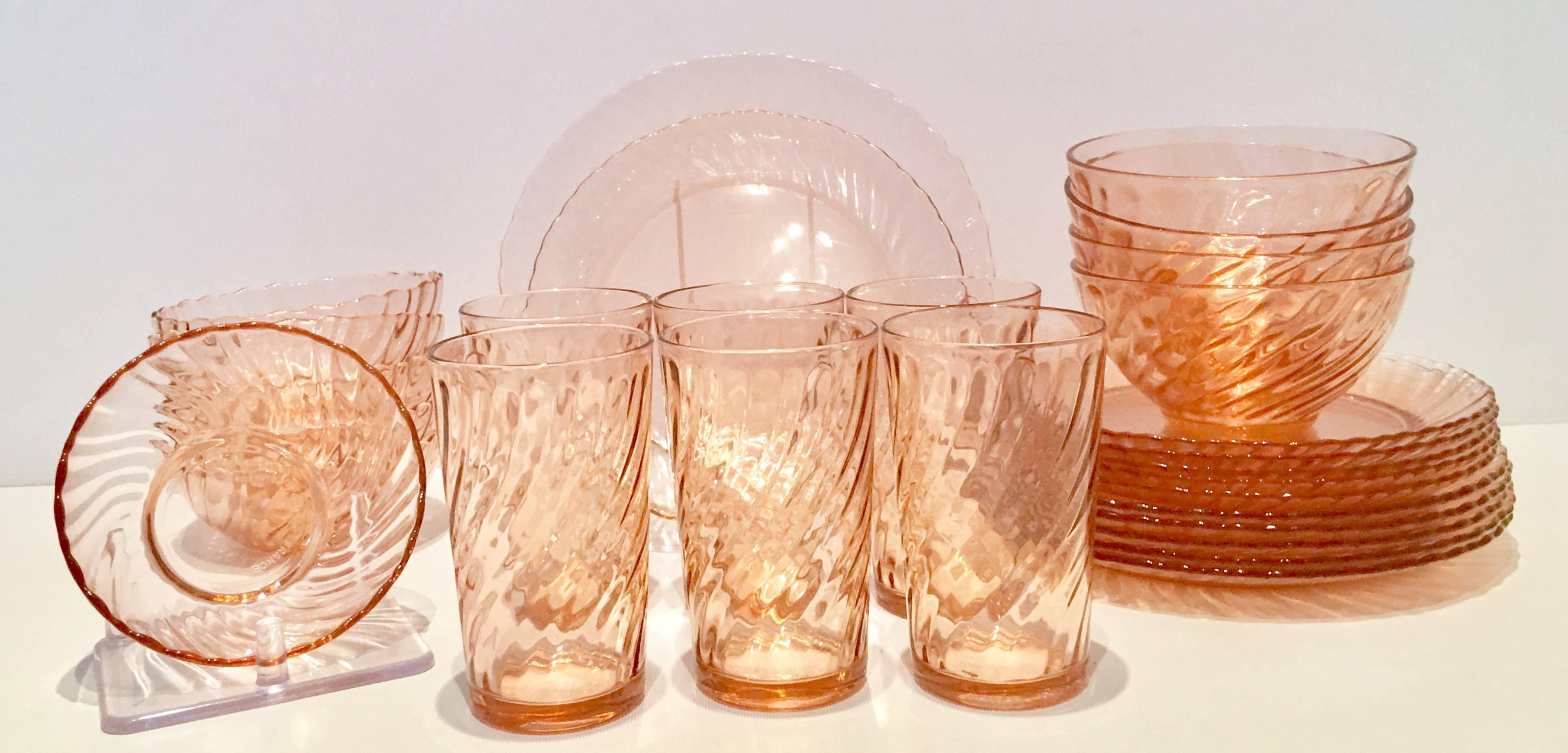 1940s blush-pink depression glass Arcoroc France dinnerware set of 28 pieces in the optic swirl motif. Features a swirl motif around the rim. Marked underside "France.
Set includes six tumblers, 4.75" H x 2.75" dia., six bowls,