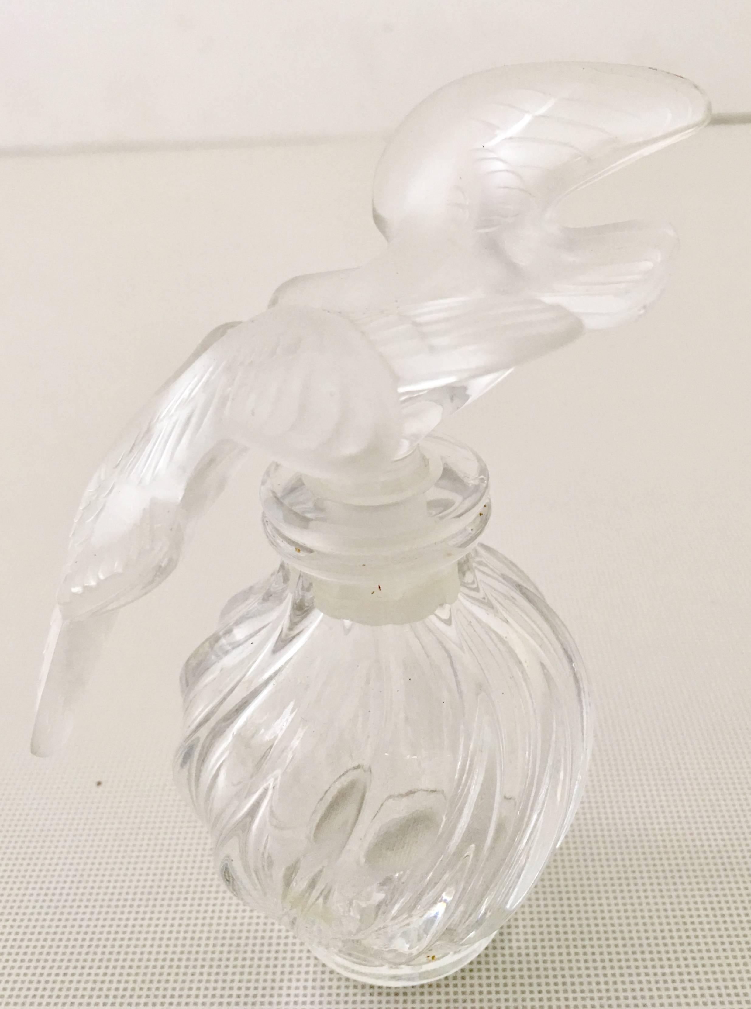 L'Air Du Temps by Lalique double dove perfume bottle and stopper. The stopper features a frosted crystal double dove and bottom is crystal clear and optic.
