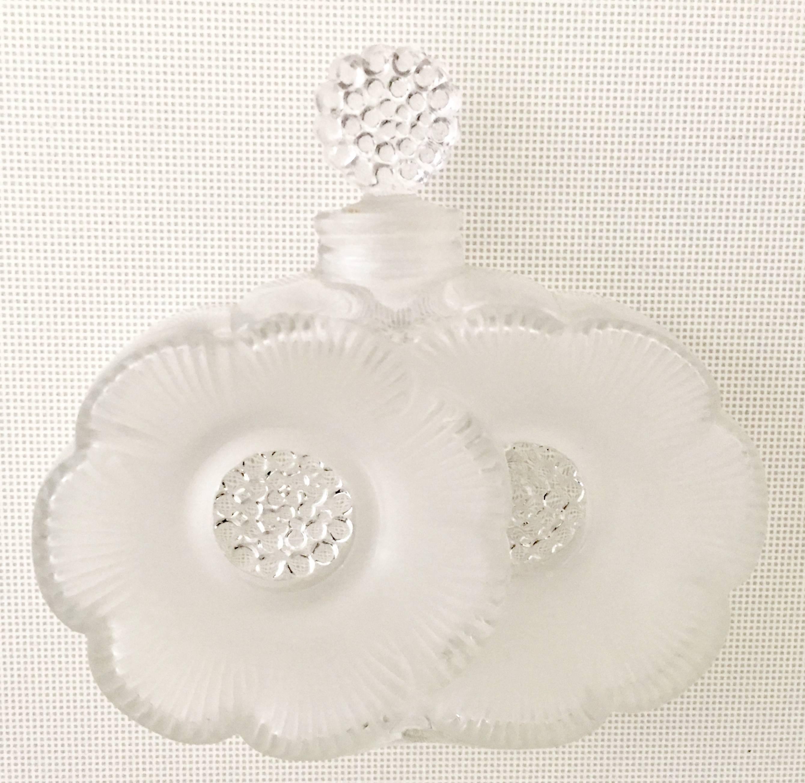 Lalique crystal frosted and clear double flower perfume decanter with stopper.
Signed on the underside, Lalique France.