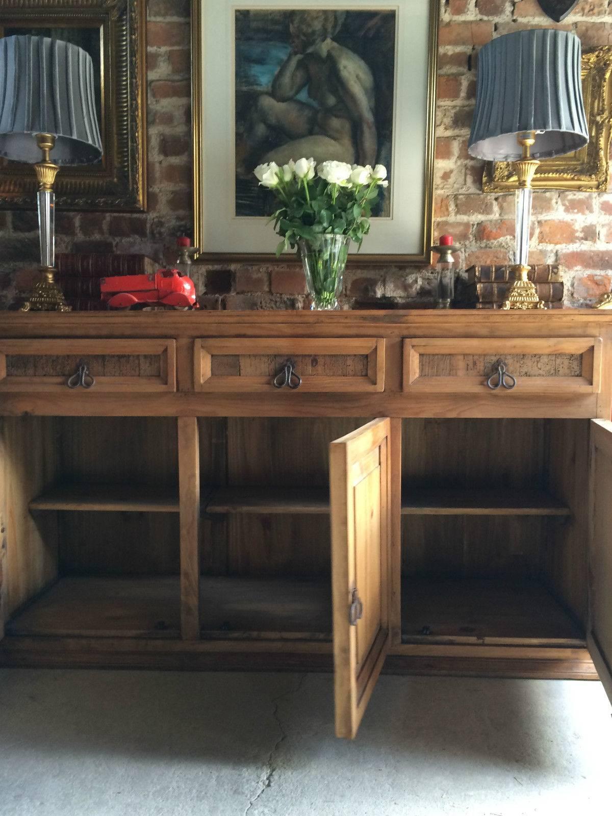 A reclaimed solid pine Welsh sideboard, the solid rectangular top over three large drawers over three cupboards with fitted shelves all with metal drop handles.